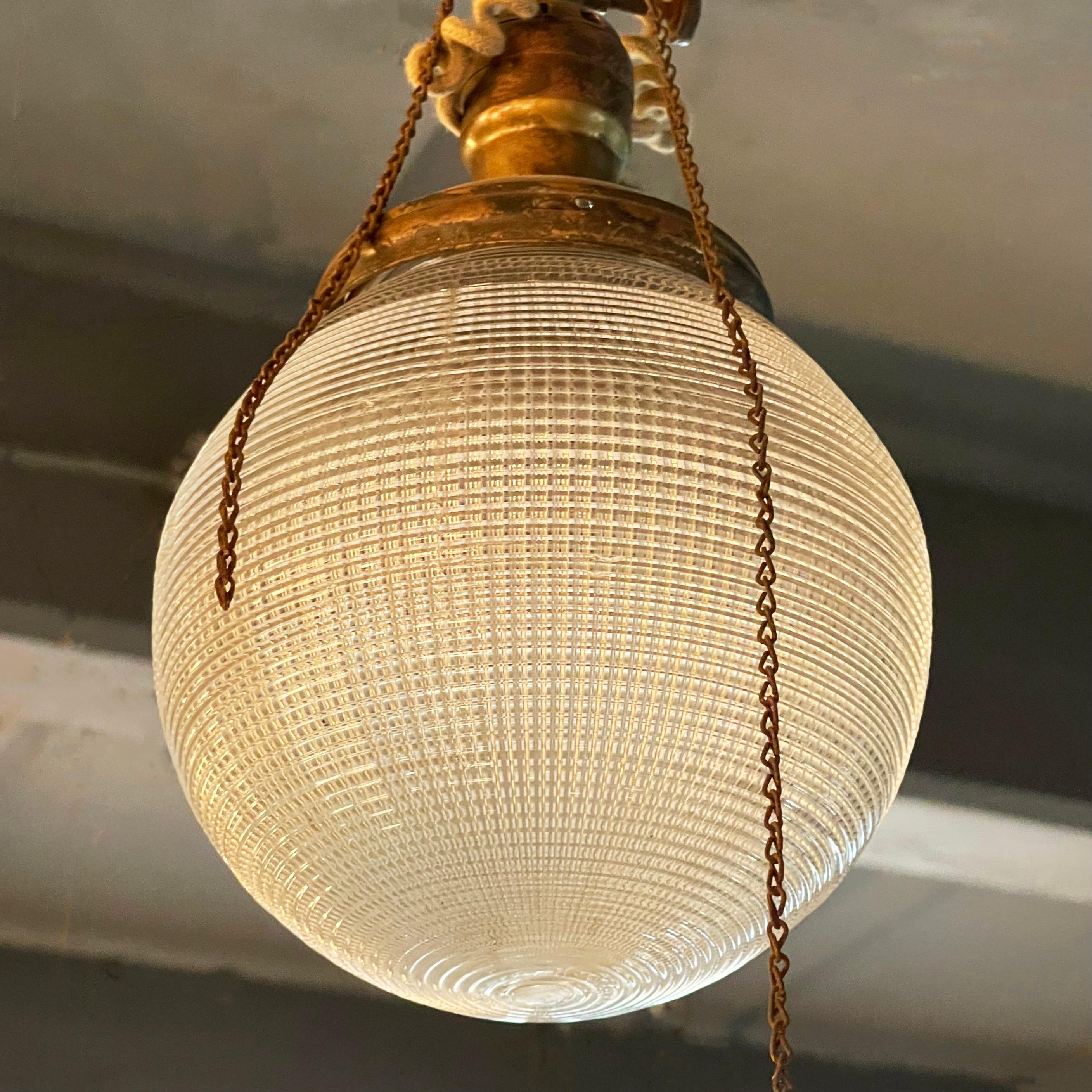 Brass Early 20th Century Industrial Prismatic Holophane Glass Globe Pendant For Sale