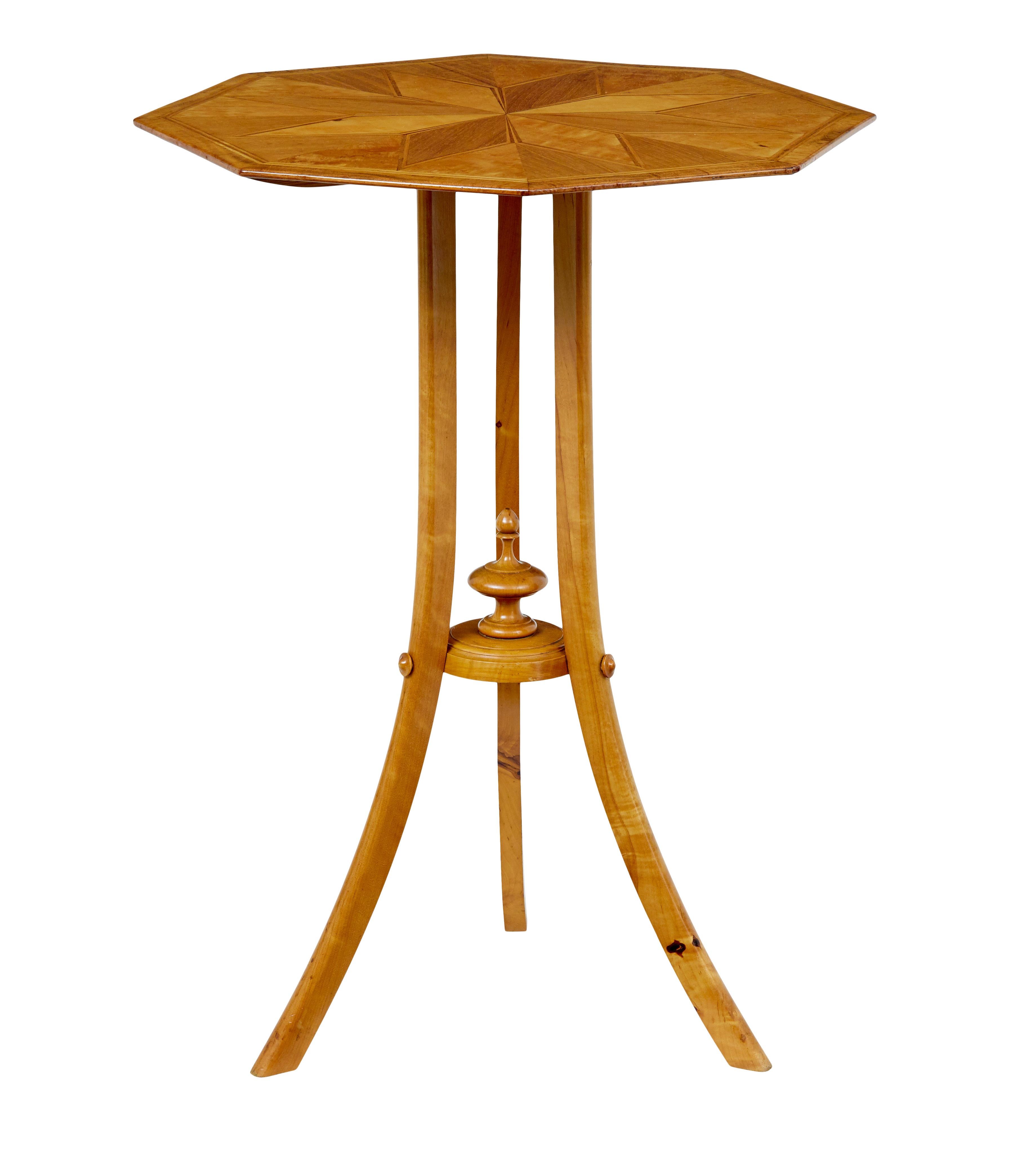 Early 20th century inlaid birch octagonal occasional table circa 1910.

Fine quality side table, that would also function well in the hall or as a lamp table.

Inlaid and strung border, with a decorative star in the centre, creating a contrast with