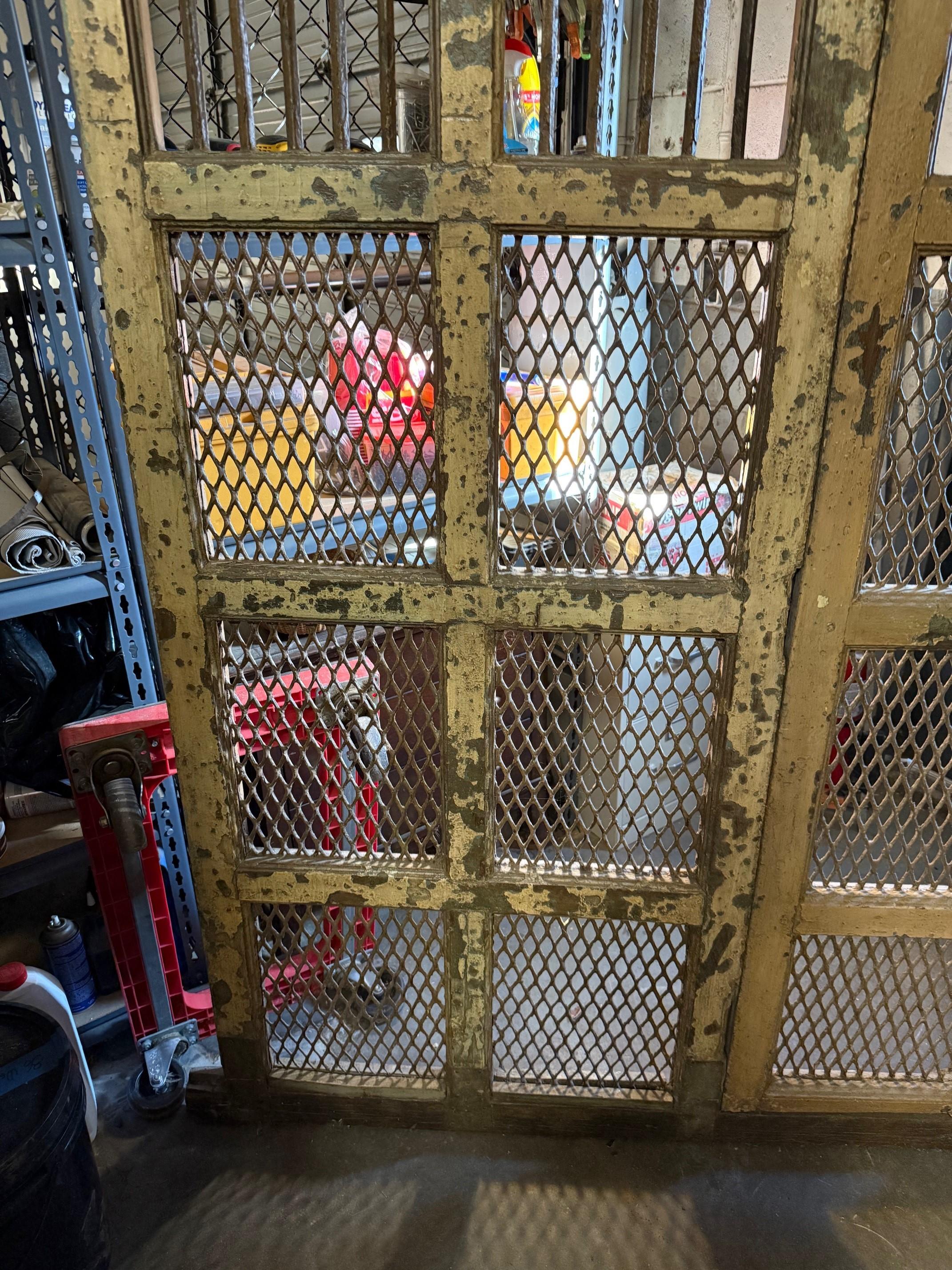 Early 20th Century Iron and Wood Divider or Panel with Doors and Metal Mesh. In Good Condition For Sale In Stamford, CT