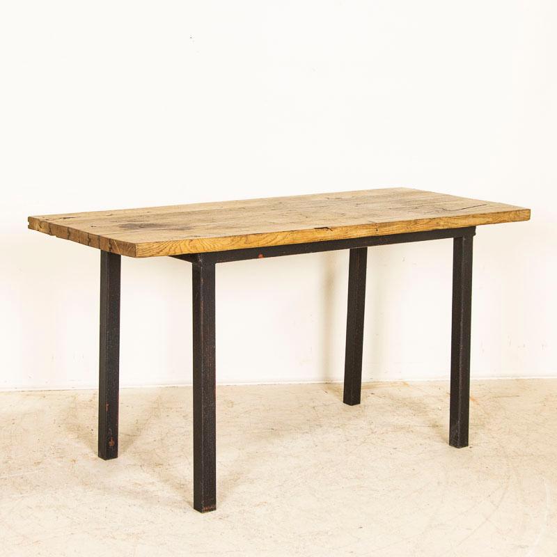 The appeal of this old work table comes from the aged wood itself, worn and distressed through years of use adding to the character imbedded in the table. Notice the expected age-related separation of the planks of wood that comprise the top, in