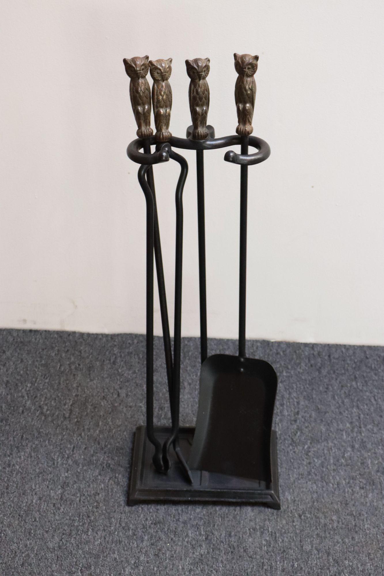 Cast iron and brass fireplace tools (ca. late 19th/early 20th Century, USA) . Features a stand, log turner, poker, and shovel, all decorated with a forged owl-form cast brass handles.
Charming set in remarkable condition for its age - iron and brass