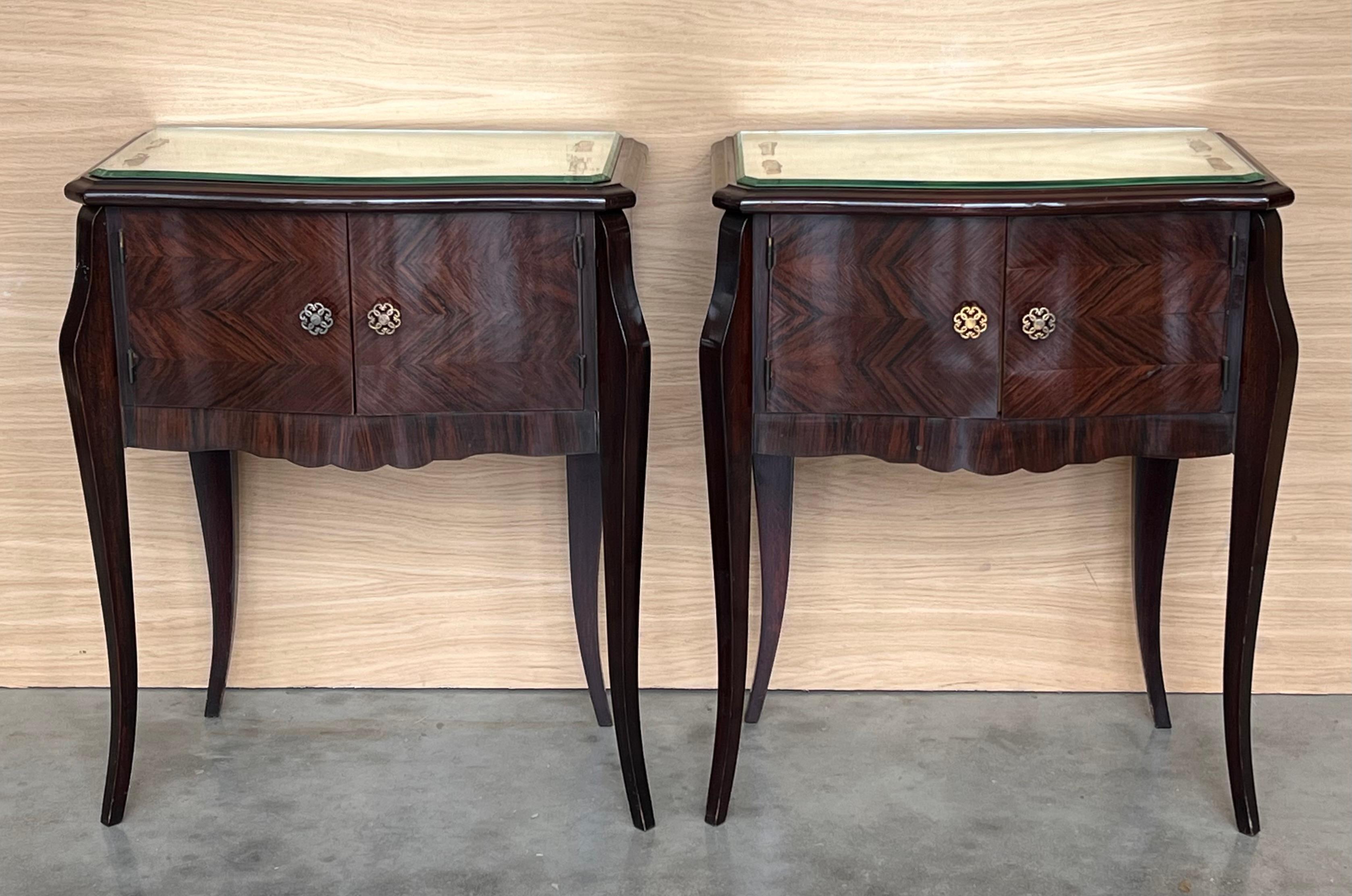 Fine pair of Italian neoclassical night stands or side tables, art deco styling, exude luxurious style from every angle! 
The polished nightstands with gorgeous marquetry doors fronts creating exquisite patterns . 
 Fluted black ebonized columns