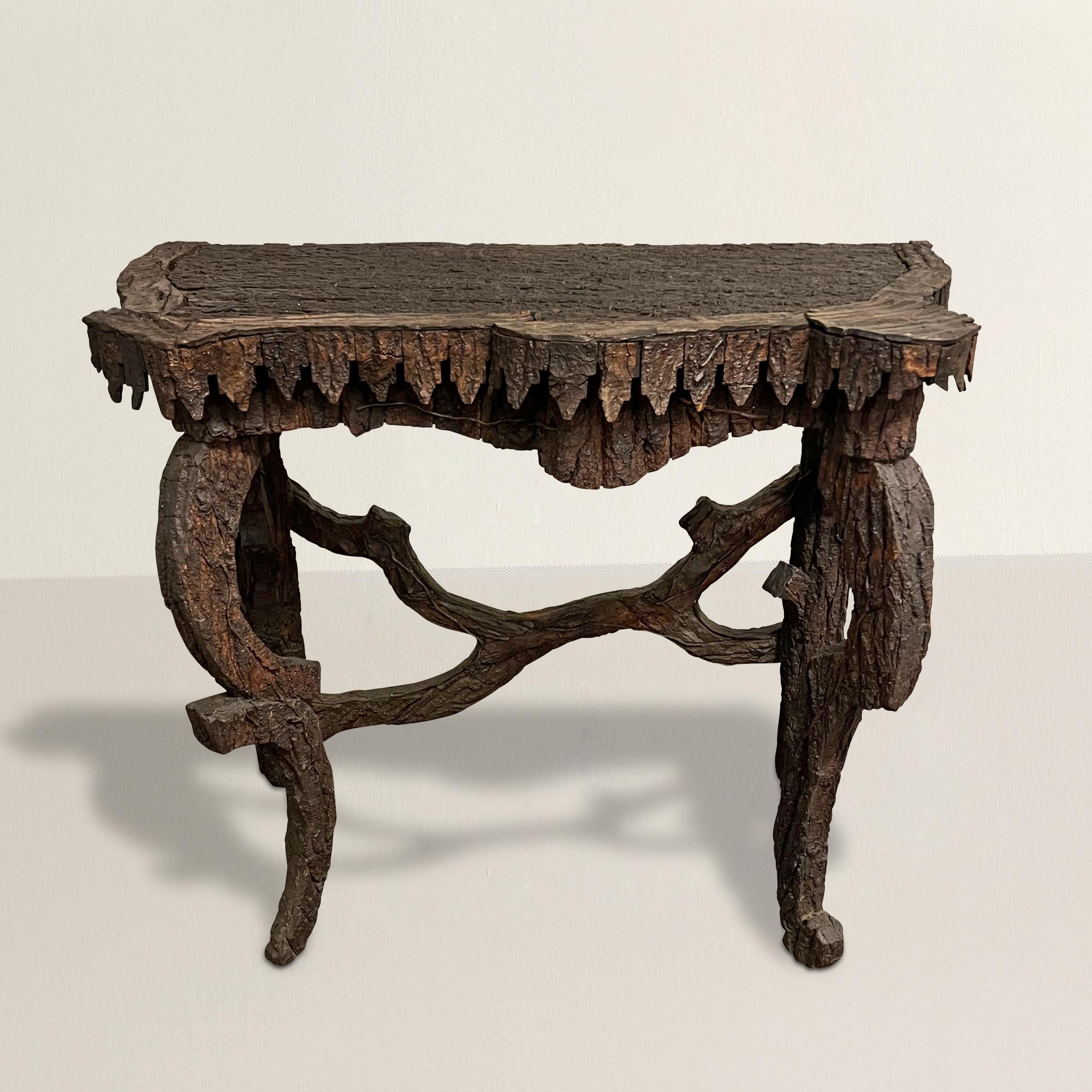 Imbued with the allure of the early 20th century, this Italian console table exudes timeless charm and artistry. Crafted from tree bark, it carries a unique texture that effortlessly captivates the eye and invites touch. Custom made for a Tyrolean