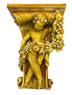 Early 20th Century Italian Baroque Revival Glazed Majolica Cherub Wall Bracket