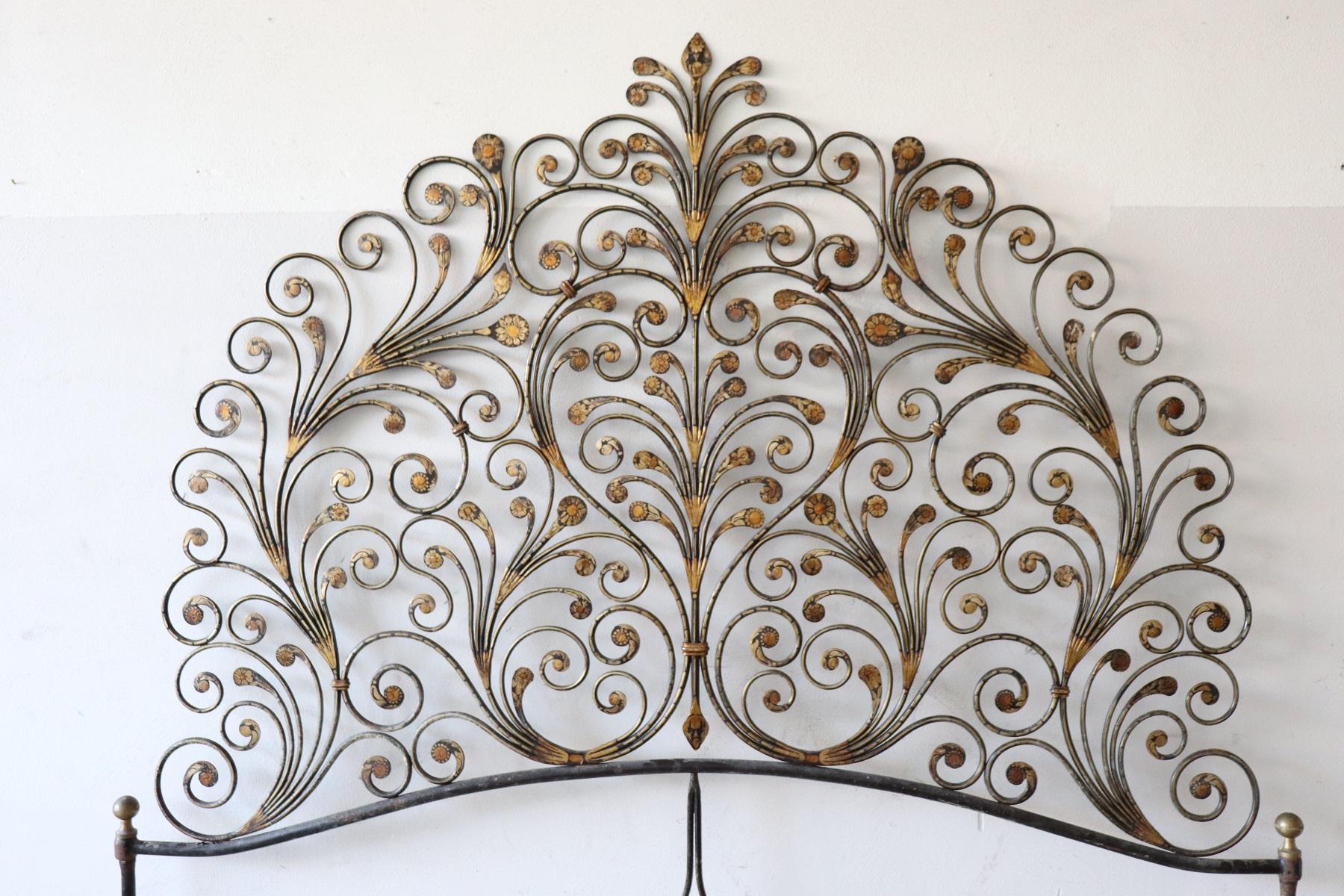 Italian Baroque style bed frame. Rich double bed headboard in gilded wrought iron. Great woodwork with lots of curls and swirls of typical Italian Baroque taste. This type of beds in Italy were typical of the city of Genoa and were called peacock