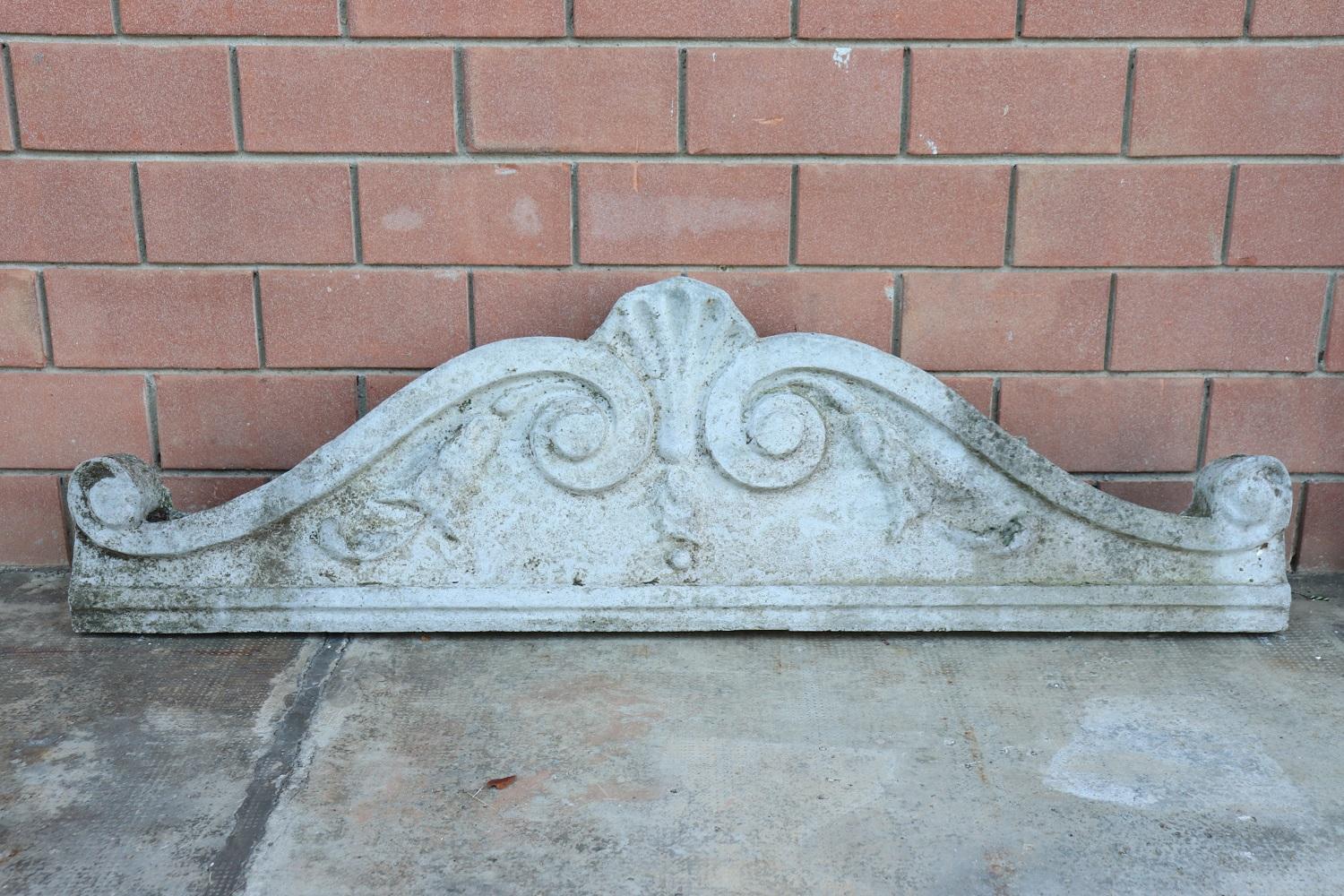Beautiful refined baroque style outdoor architectural frieze, circa 1920s in cement. Beautiful baroque revival with curls, swirls and a large central shell. This type of architectural element was usually positioned above a door. Shows signs of the