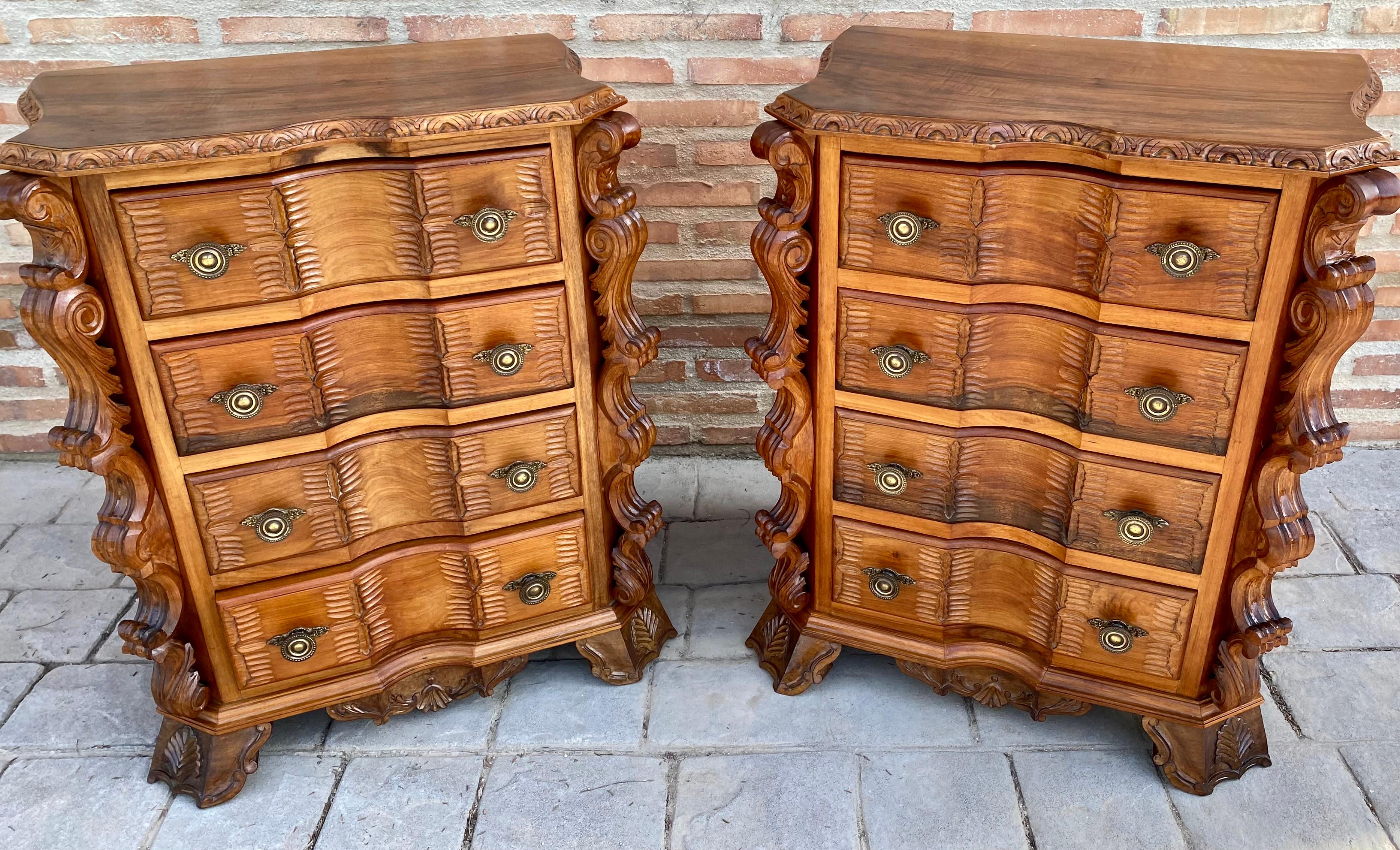 Having butterfly form tops and drawers with rounded corners and molded edges above conforming cases housing three drawers, the drawers intricately veneered with various tones of burl walnut and cherrywood, retaining antique hardware, having shaped