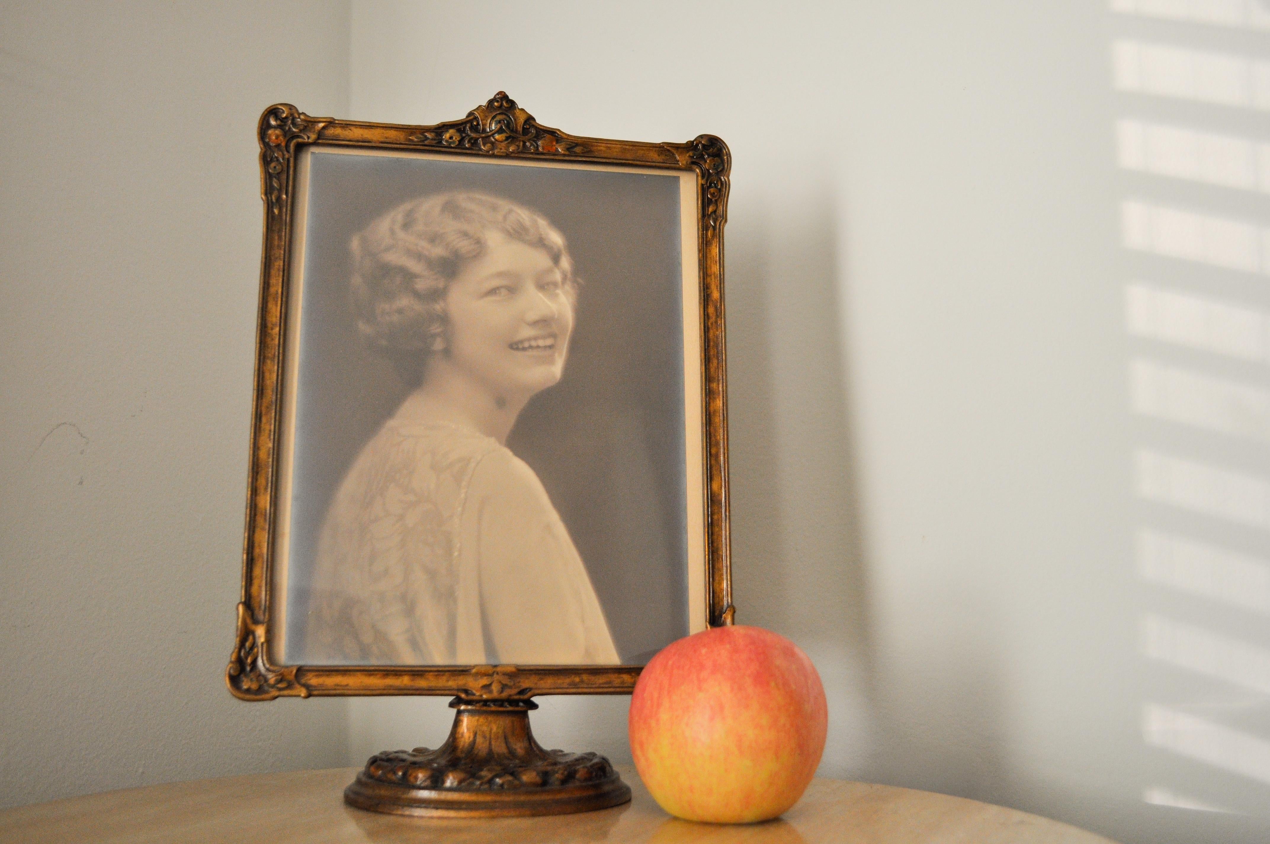 A beautifully preserved early 20th century Italian carved wood tabletop photo frame, crafted circa 1915–1925 and notable for its substantial, large-scale presence. This elegant piece captures the essence of Italian Art Nouveau, with hand-carved