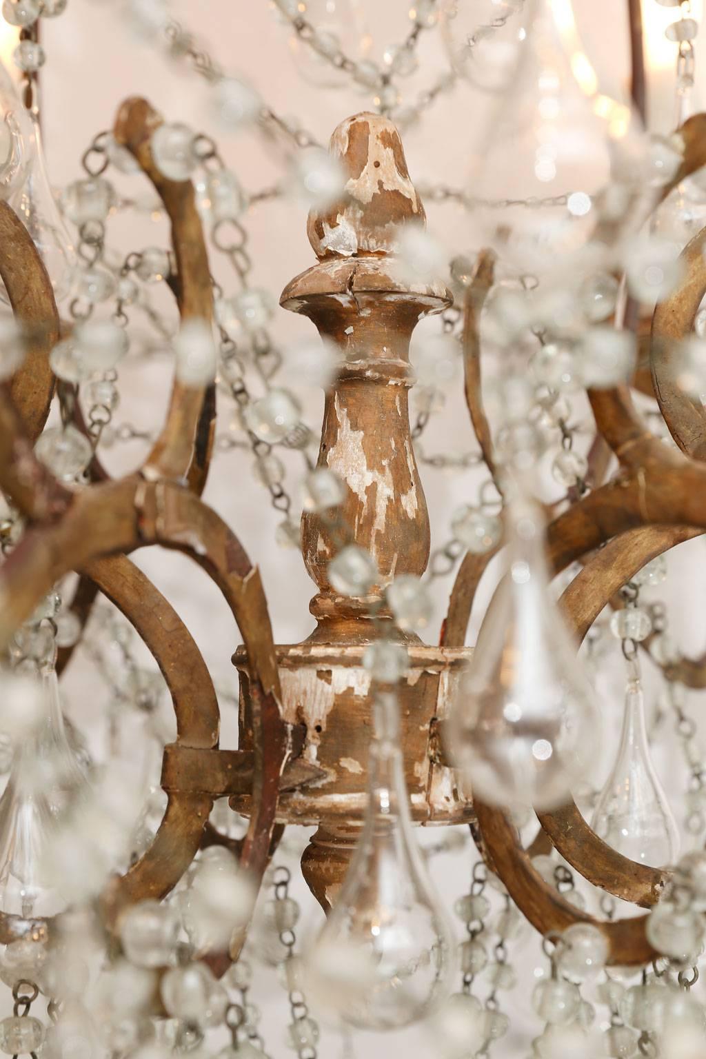 Hand-Carved Italian Chandelier in Wood, Gilt-Iron and Glass For Sale