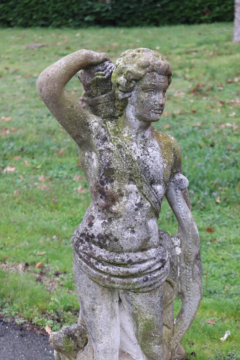 Beautiful refined garden statue, circa 1920s main material stone mixed with cement and marble dust, stone grit. Beautiful and majestic statue. A beautiful representation of valiant archer with his bow and arrows, his faithful dog at his feet. Shows