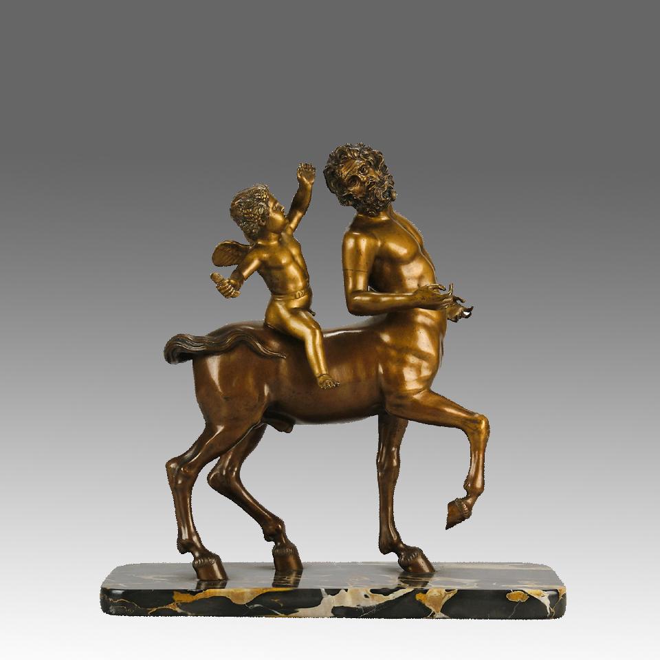 Un raffinato gruppo in bronzo dorato dei primi del Novecento, raffigurante Cupido a cavallo di un Centauro, con un'eccellente patina dorata e dettagli molto curati, su una base di marmo.

INFORMAZIONI AGGIUNTIVE
Altezza:                             