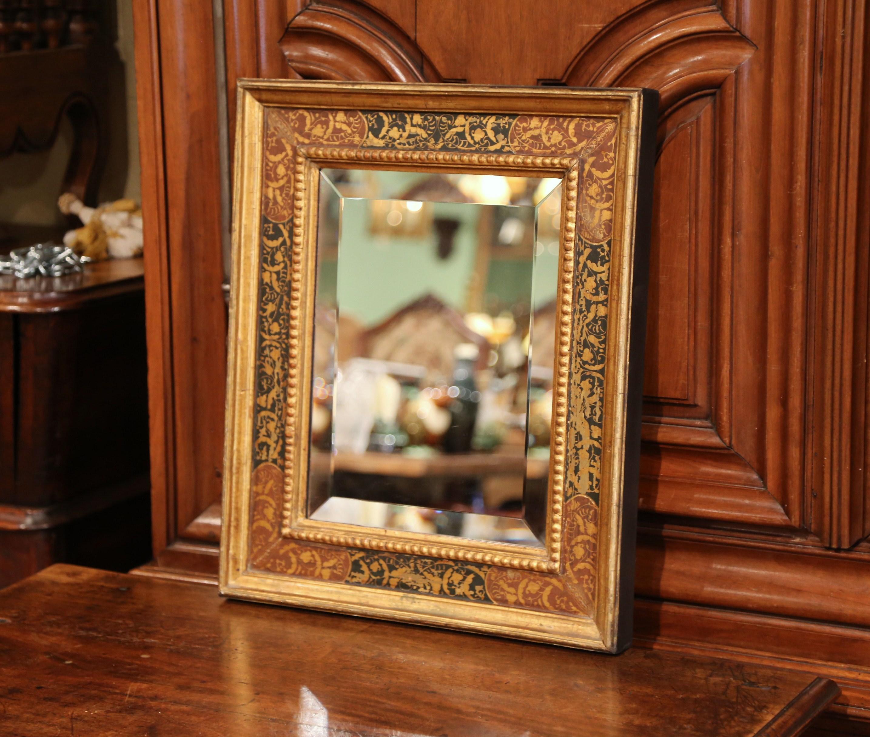 Decorate a room or hallway with this ornate, antique mirror. Carved and painted in Italy circa 1920, the dramatic, Italian rectangular mirror features colorful, hand painted floral and foliage decor around the frame. The elegant frame is decorated