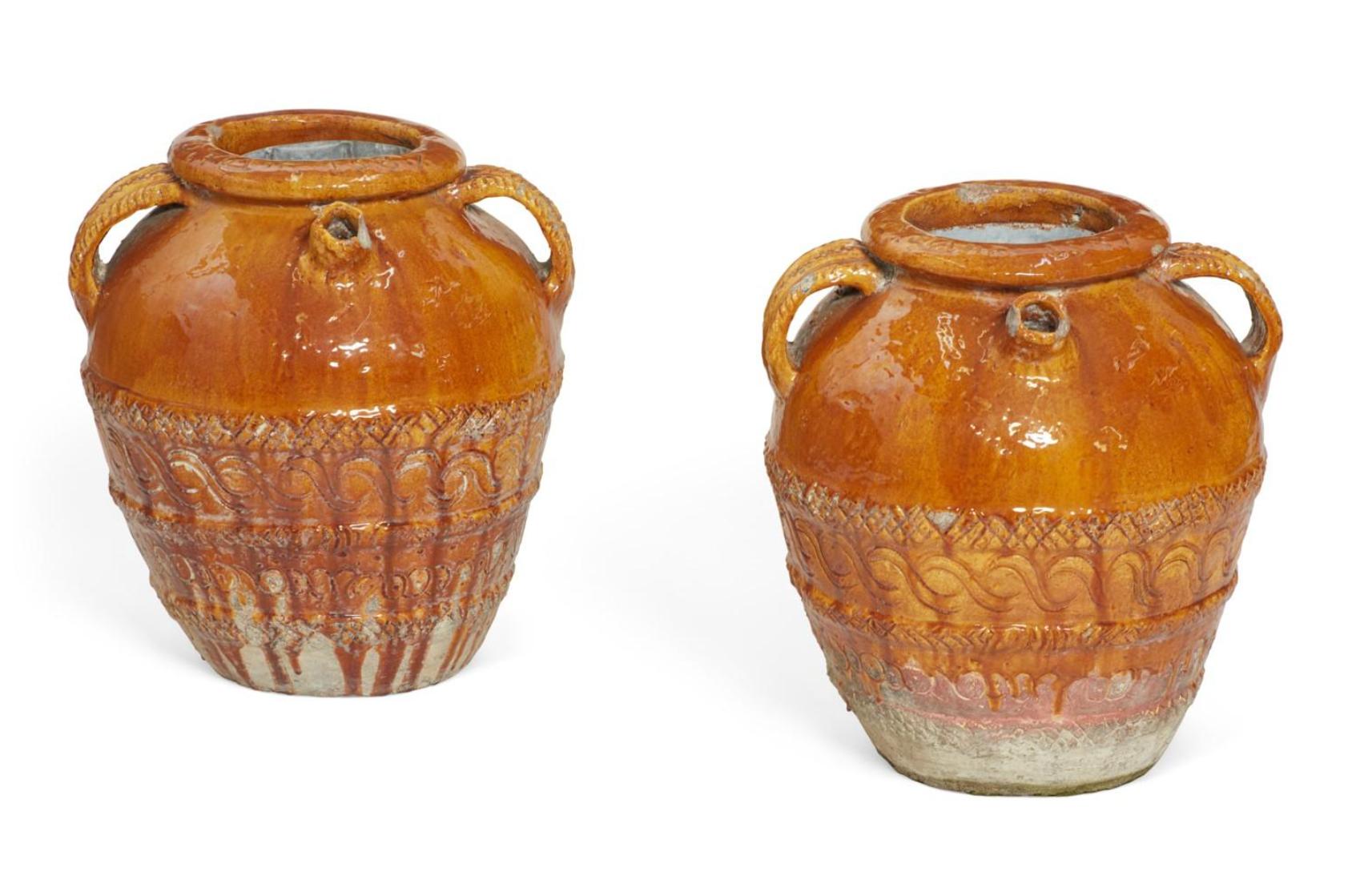 Early 20th century Italian glazed earthenware jars.

Measures: 21
