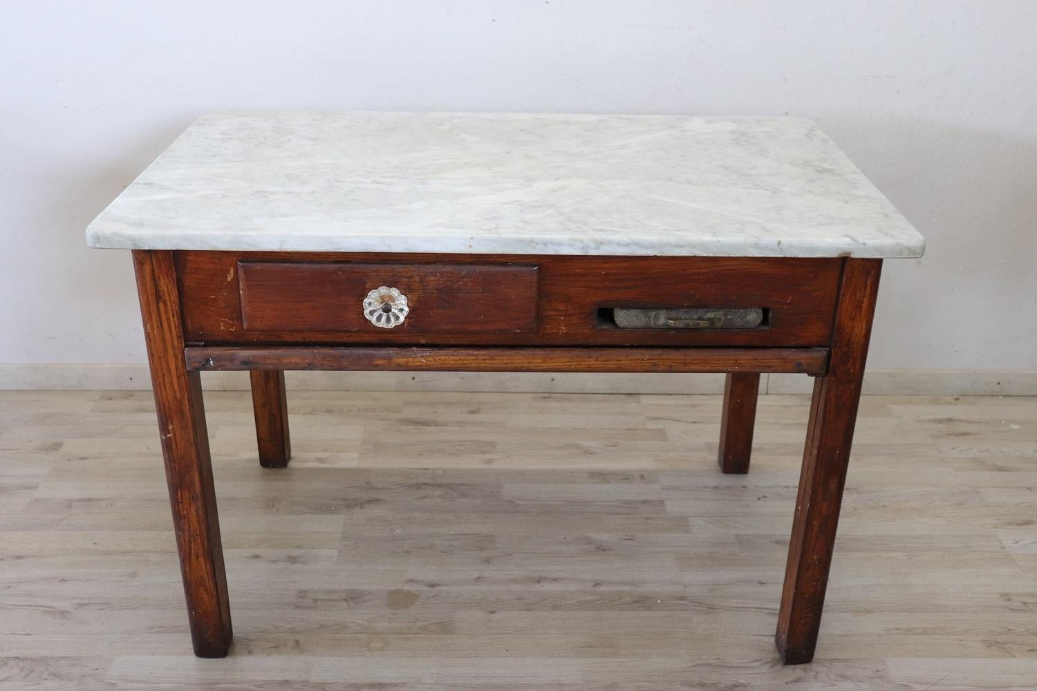 Beautiful very nice Italian oak wood kitchen table, 1930s with marble top. The table is equipped with many accessories necessary for the preparation of pasta. This type of table was used in the early 1900s by Italian women who loved cooking and