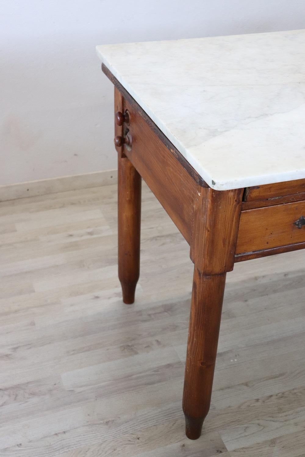 Beautiful very nice Italian fir wood kitchen table, 1930s with marble top. The table is equipped with many accessories necessary for the preparation of pasta. This type of table was used in the early 1900s by Italian women who loved cooking and