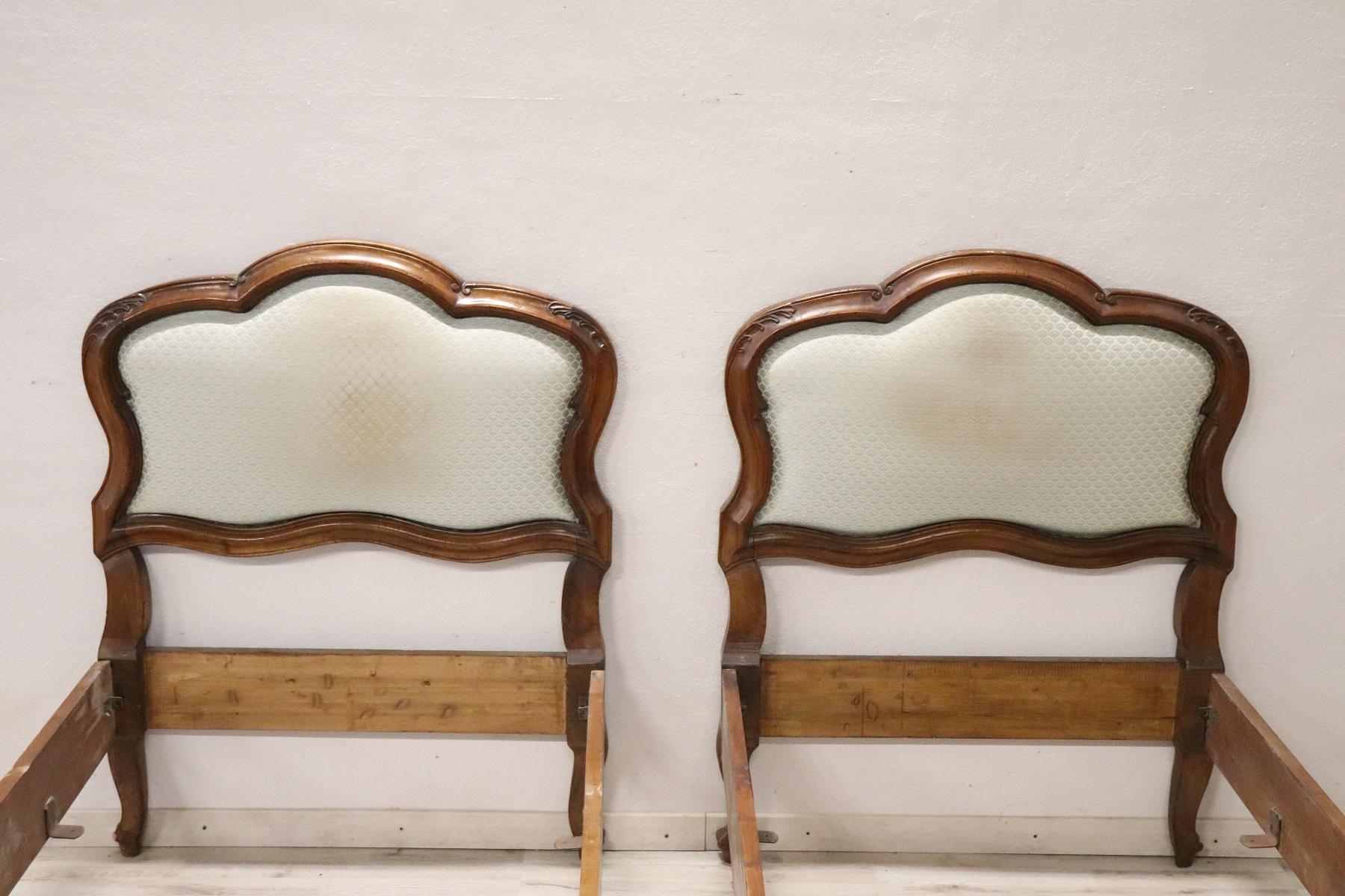 Beautiful Italian pair of single bed 19200s in walnut with finely carved on the front. The measurements shown are outside the internal are cm 82 x 200. In vintage goods conditions, stains in the fabric.
  