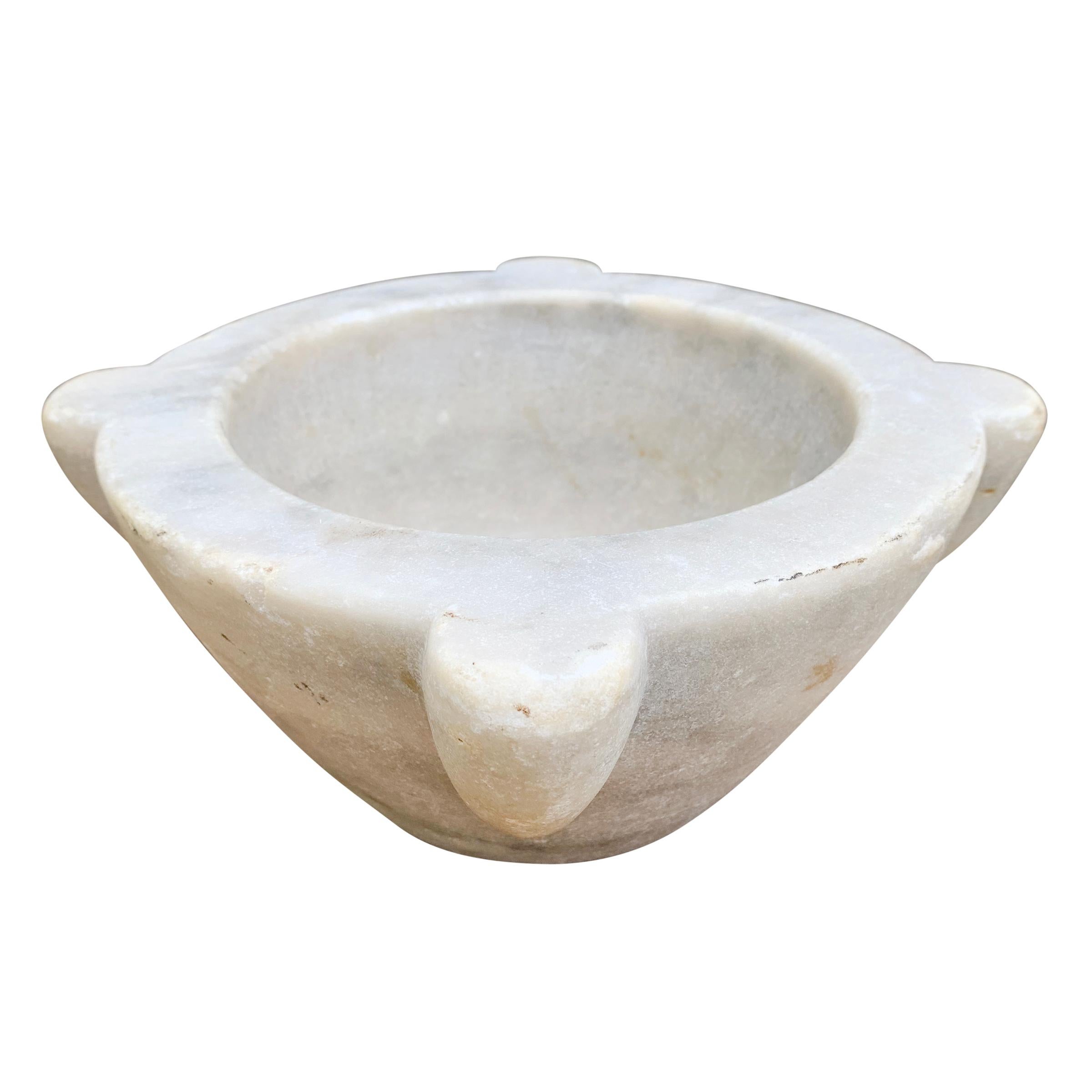 A wonderful early 20th century Italian carved marble mortar originally used to make pesto, now perfect for keeping your salt and pepper at arm’s reach, crushing other herbs and spices, or serving chips at your next fête.