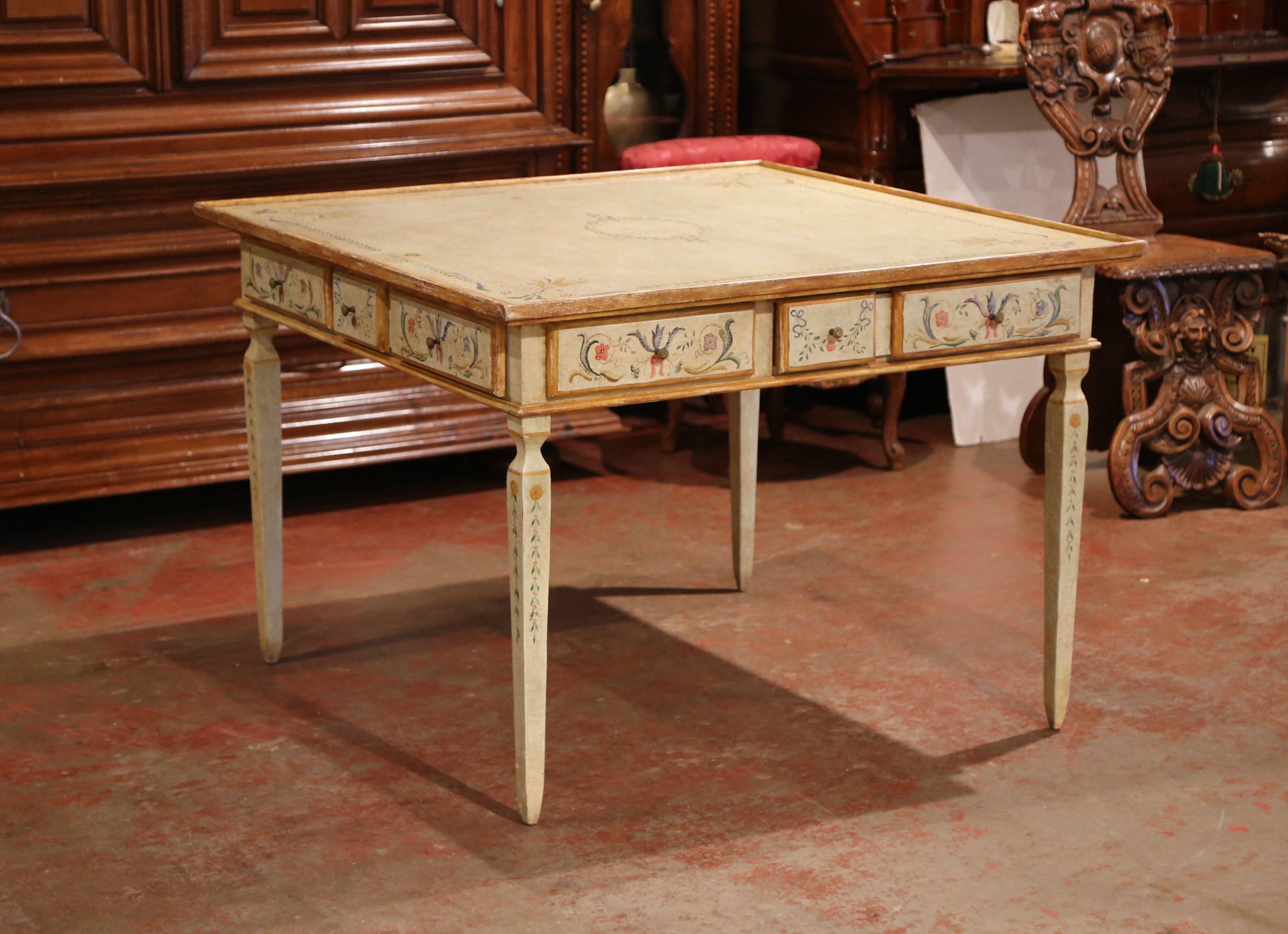 This elegant hand painted square table was created in Italy, circa 1920. The traditional, antique game table stands on four tapered legs and features a square top embellished with raised edges. The table is outfitted with drawers on all four sides,