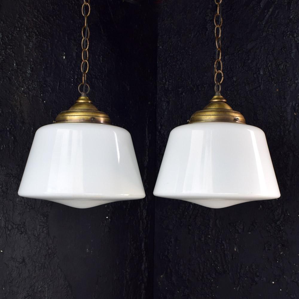 Early 20th century Italian opaline glass light pendants.

We share what we love, and we love the soft light that comes through this pair of early 20th Century Italian glass opaline and brass gallery light pendants. With their original ceiling rose