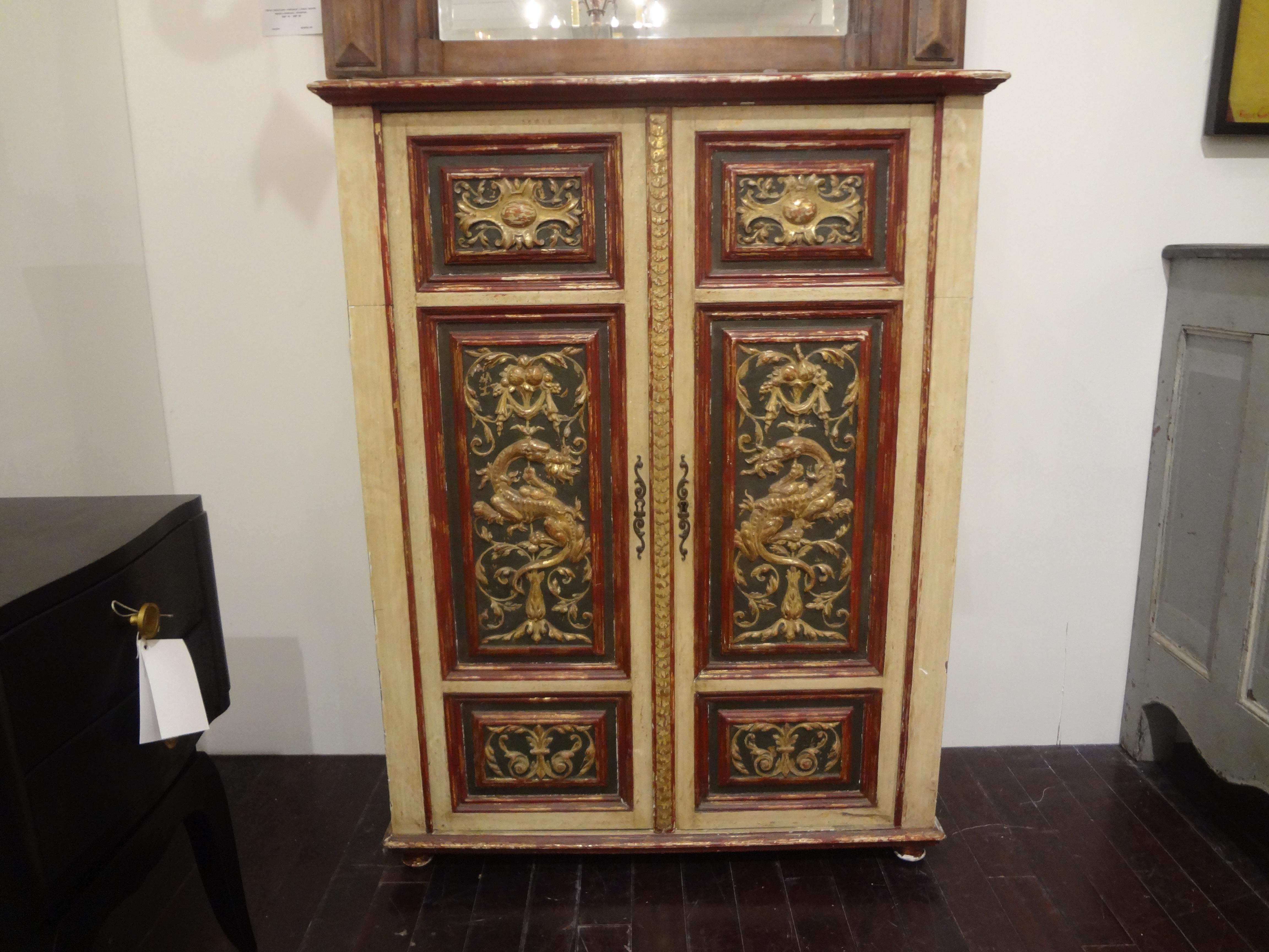 Italian painted and giltwood chinoiserie cabinet.
Stunning versatile Italian painted and gilt wood chinoiserie 2-door cabinet, bookcase, bar or cupboard resting on bun feet. This gorgeous Italian giltwood storage cabinet dates to 1920. Our