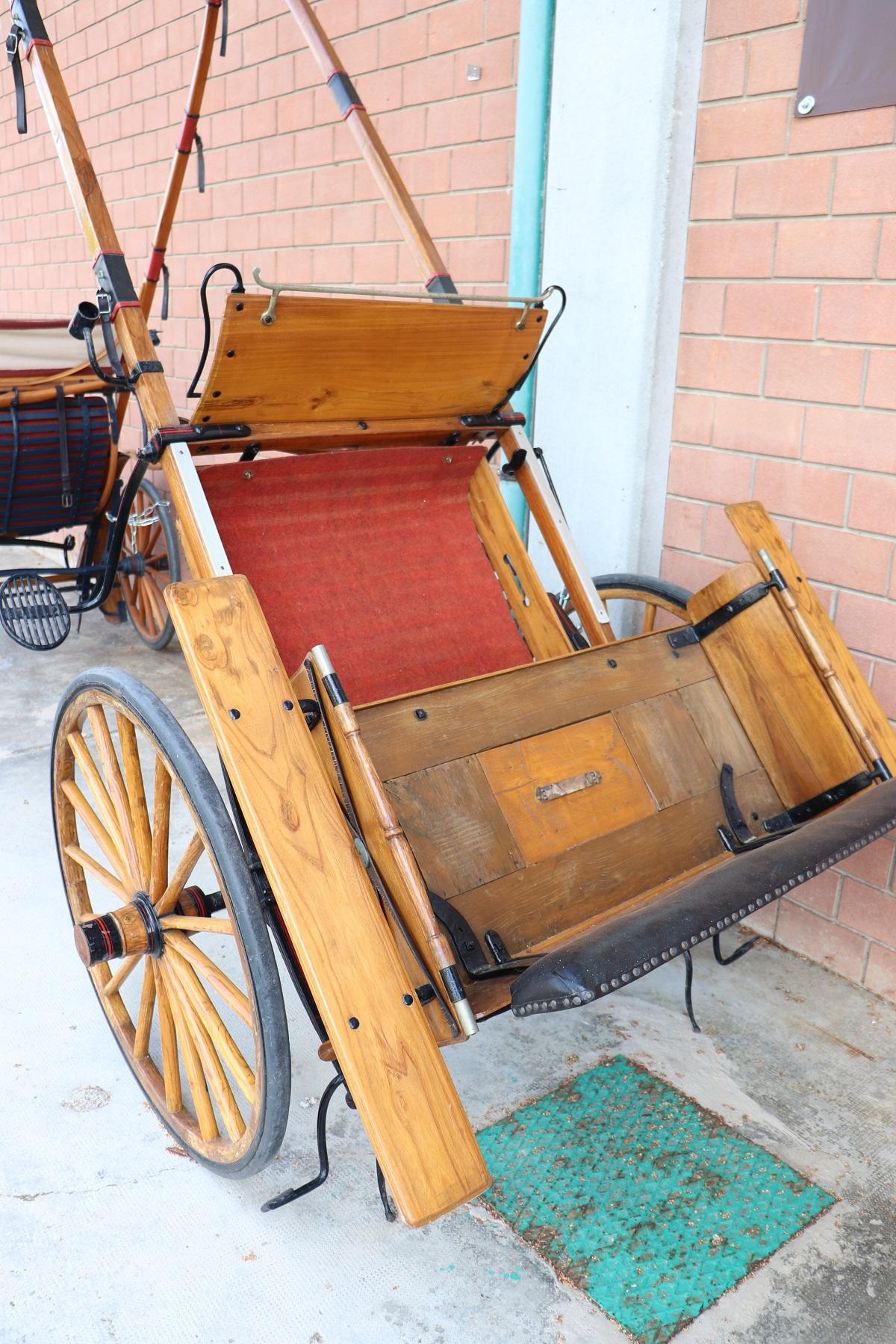 Rare early 20th century Italian pair of horse drawn carriage buggy carriage wagon. Made of solid chestnut wood they are rare and fascinating items from the past. They can be used or simply displayed as a garden ornament. A seat cushion is missing.