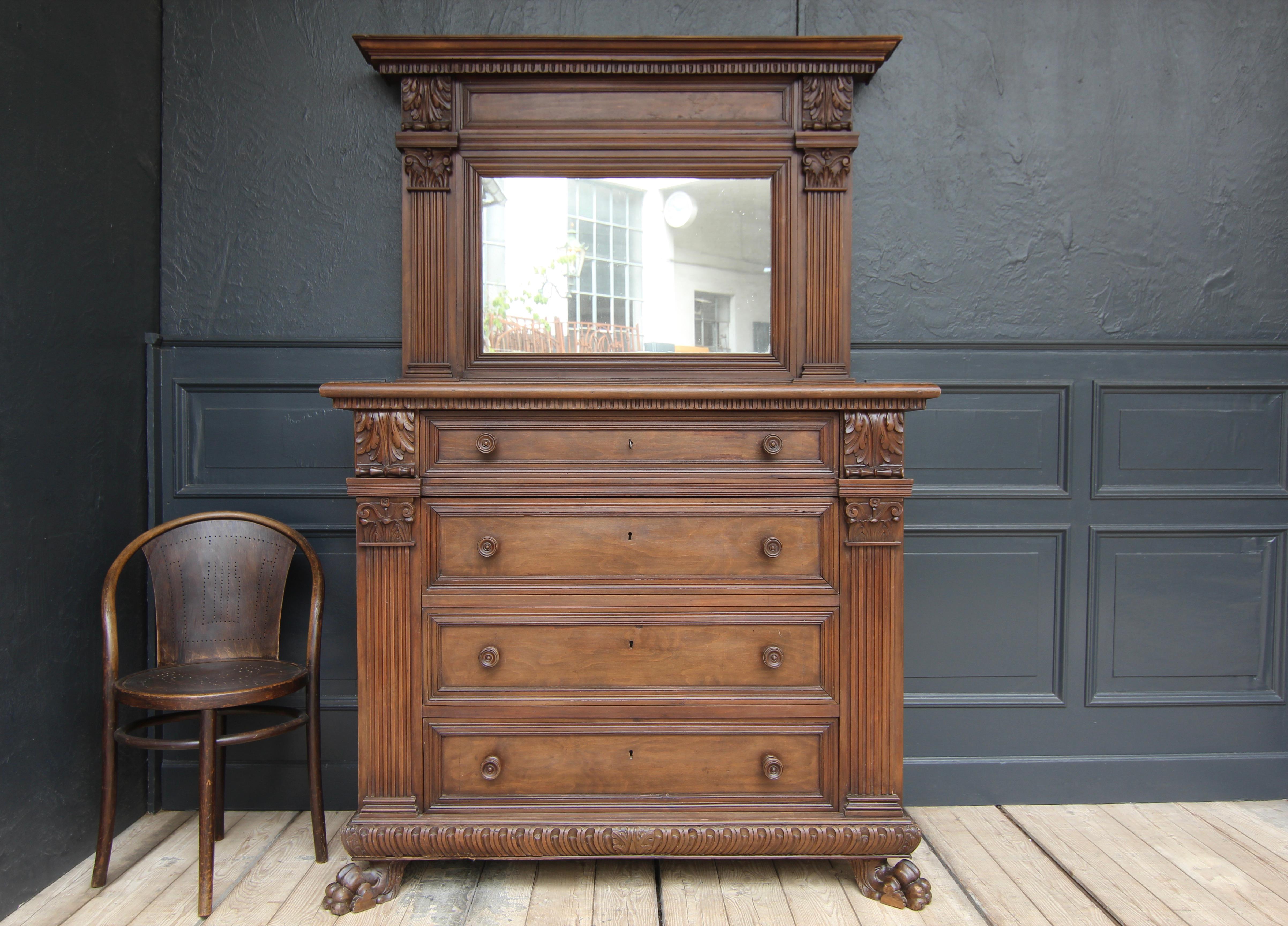 Large Italian Renaissance-Revival chest of drawers with mirror top. Tuscany, early 20th century. Solid walnut as well as veneered on pine.

Side coffered chest of drawers with 4 large drawers under a slightly overhanging profiled top plate. Wide