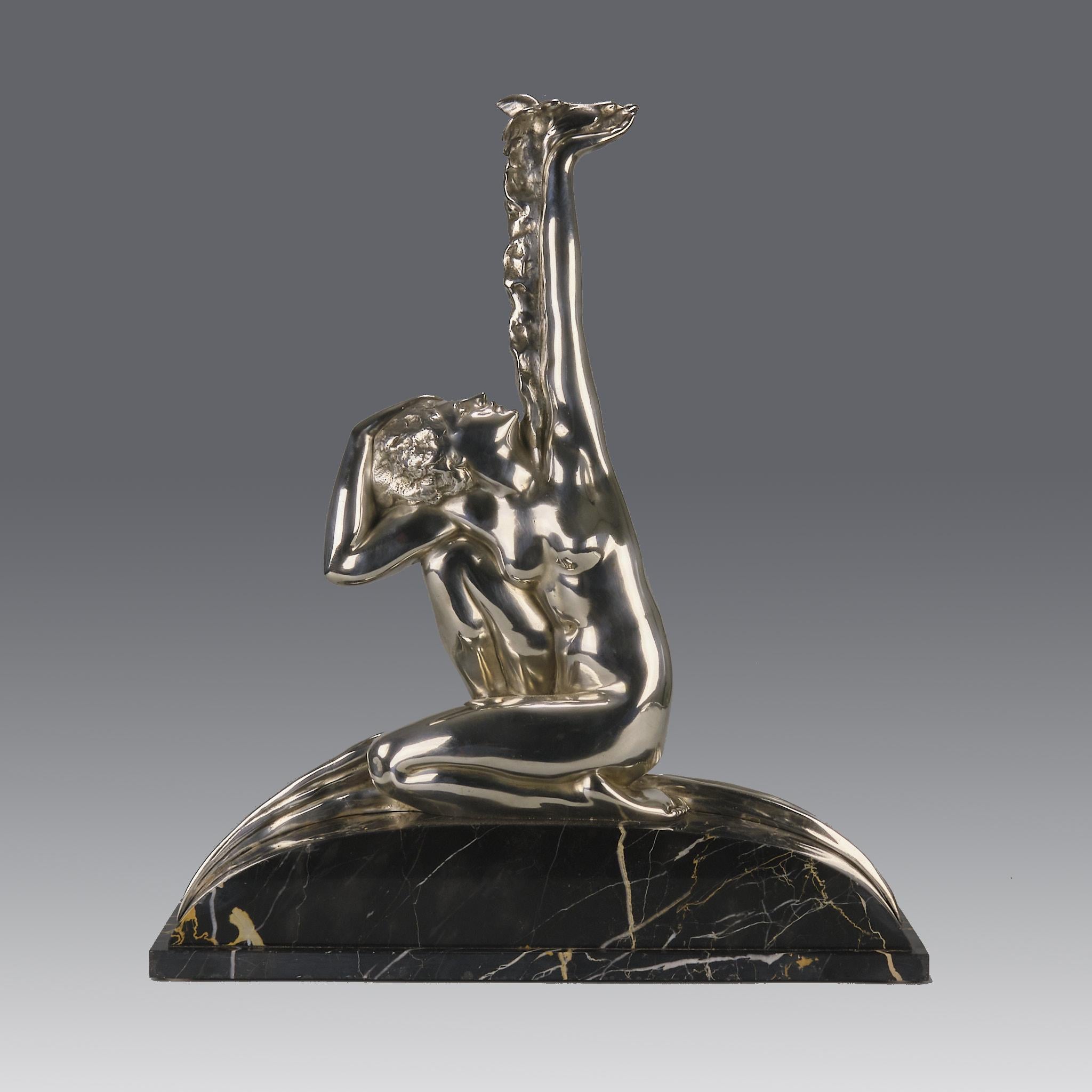 An attractive early 20th Century Italian Art Deco silvered bronze figure of a naked kneeling beauty holding aloft a dove in her hand, exhibiting excellent detail and very fine detail. Raised on a portoro marble base and signed A.