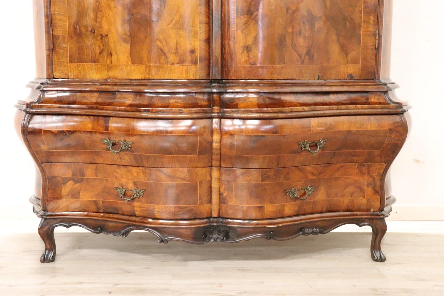 Rare early 20th century Italian Venetian Louis XV style wardrobe, 1910s. Particular rounded and wavy shape. Made of fine walnut burl. Equipped with two drawers. Equipped with a stick for hanging clothes. Very elegant perfect for refined environments.