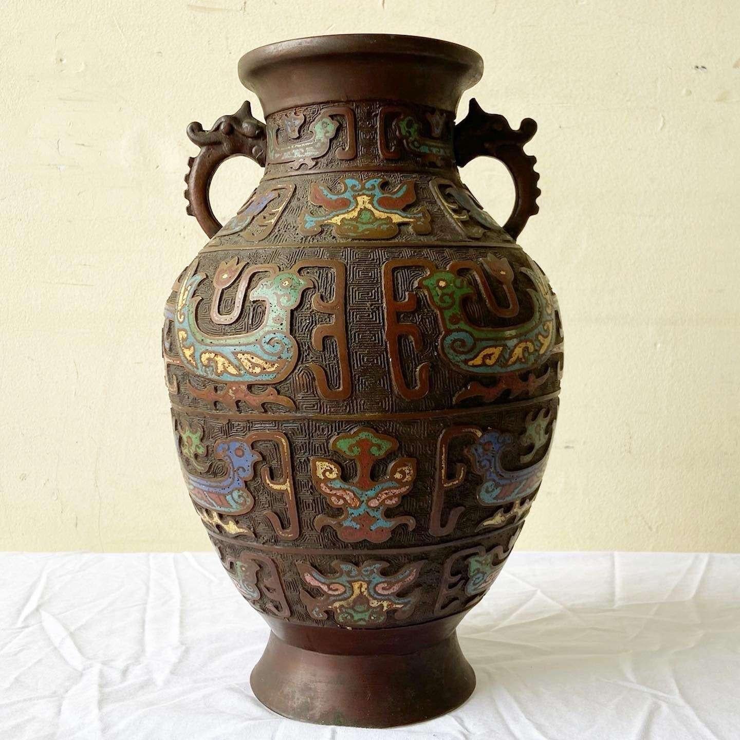 Exceptional vintage early 20th century champleve brass vase. Features a vibrant enamel design throughout the vase.
