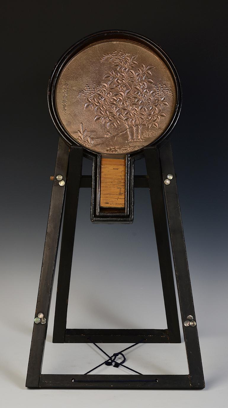 Japanese bronze mirror with wooden case and stand.

Age: Japan, Showa Period, early 20th century
Size of mirror only: Height 40 C.M. / Diameter 27.5 C.M.
Size of stand only: Height 67.8 C.M. / Width 34.4 C.M. / Depth 33 C.M.
Condition: Nice
