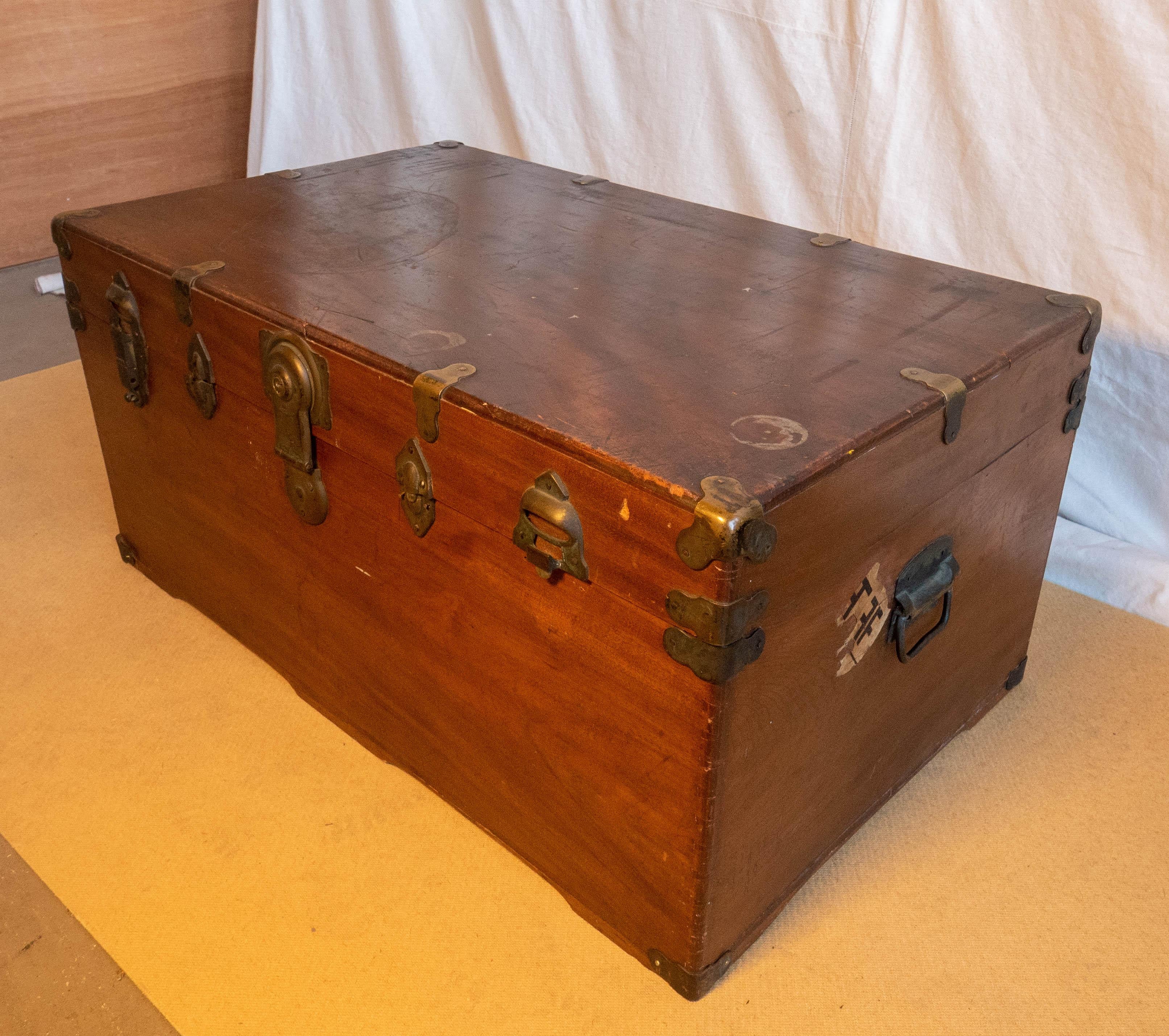 Early 20th century Japanese Camphor Wood Campaign chest, WW I or WW II vintage, a sailor's camphor wood chest with brass binding and clasps, with original key and period decals. It is interesting to see the walls of this chest are much thinner and
