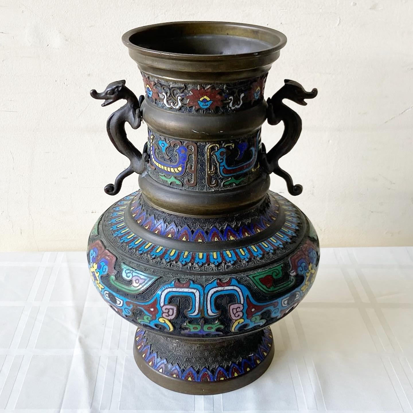 Exceptional early 20th century Japanese brass champleve. Features vibrant enameled decorative designs throughout the vase.
