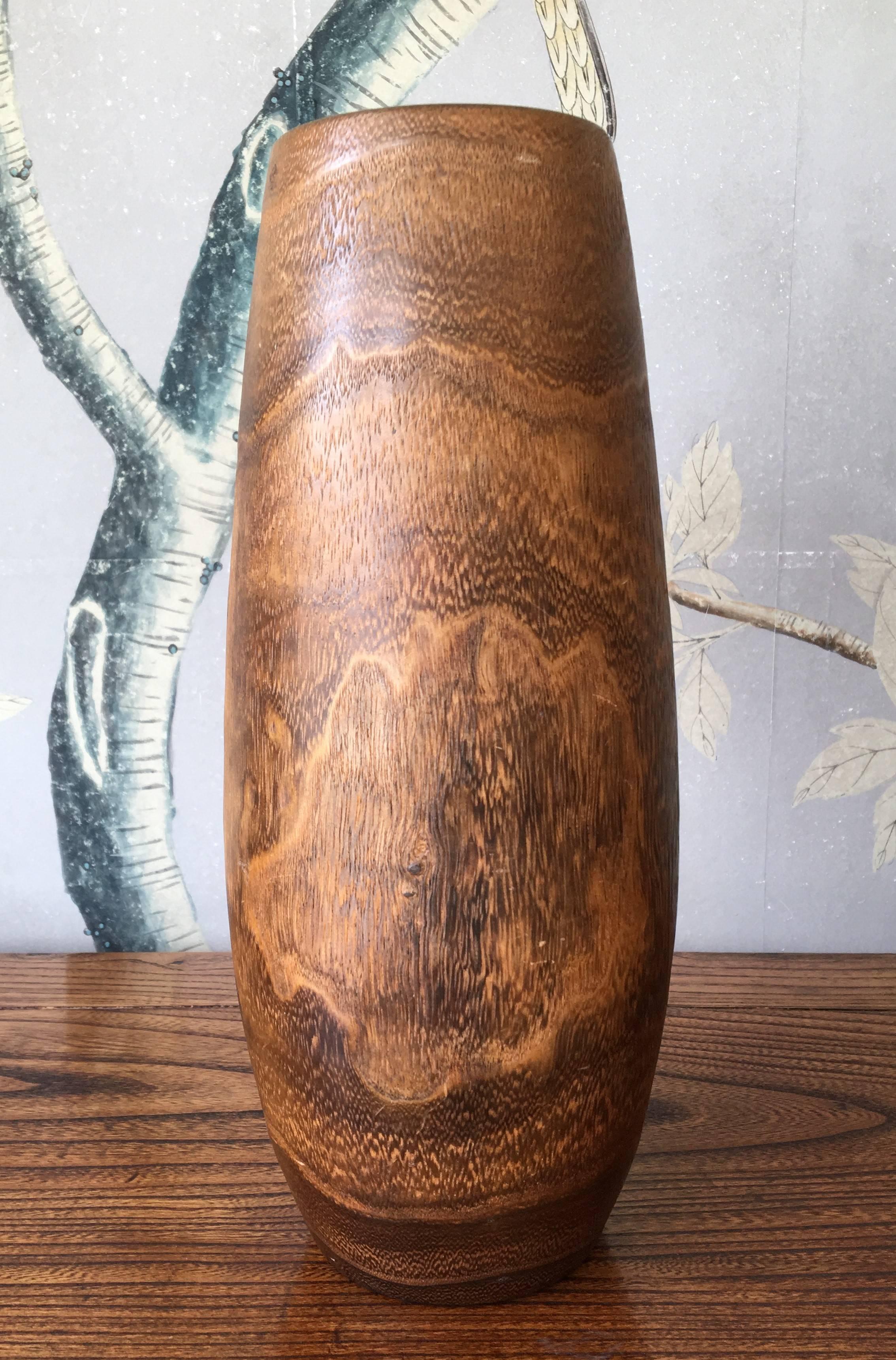 An antique Japanese hand-carved wooden Ikebana vase with design of birds and leaves with a copper liner. Great for flower displays.