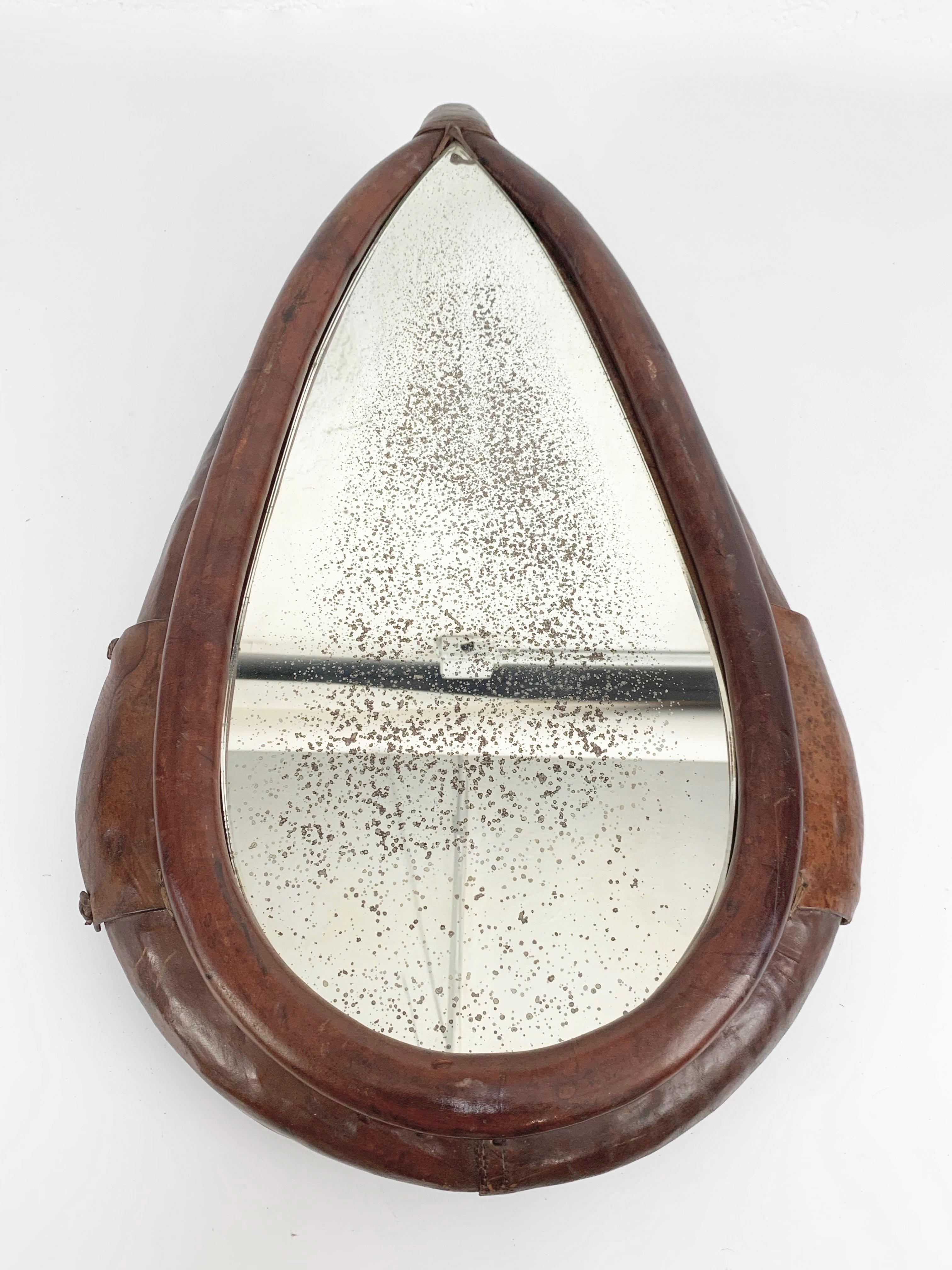 Original decorative collar in leather from 1917, converted into wall mirror.

The producer of the leather collar is K. Petermann, and this unique frame was produced in Dietlikon, Switzerland. The collar has the production number 
