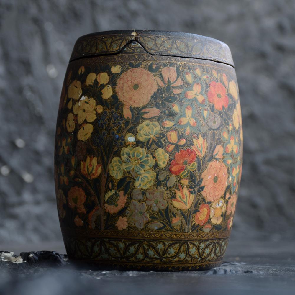 A wonderful example of an early 20th century handcrafted papier mâché tobacco jar. Hand painted detailing an intricate floral pattern in various colours and gold leaf. The base still has the original makers stamp attached. A highly decorative