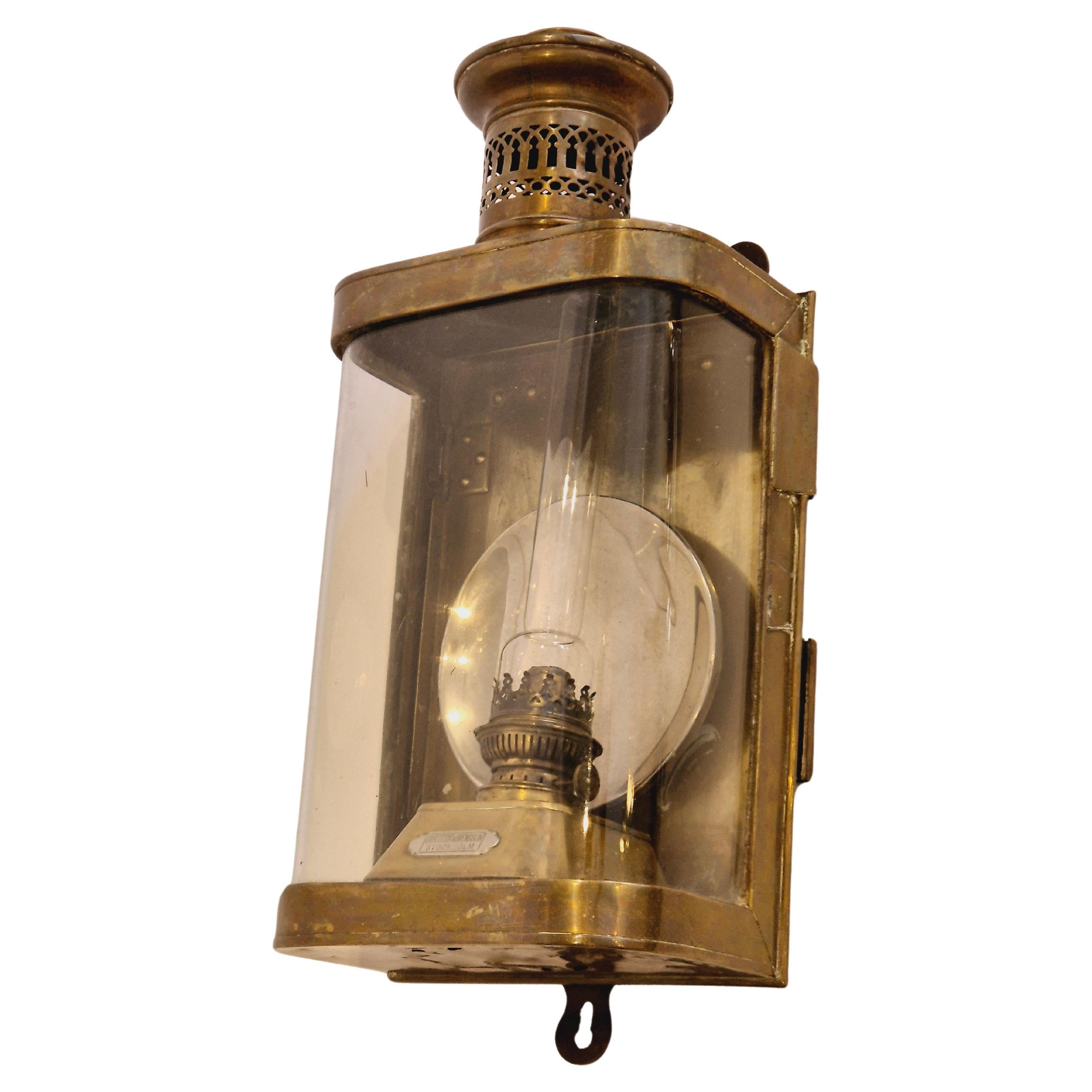 Early 20th century kerosene bulkhead lamp/lantern in brass, detachable burner.