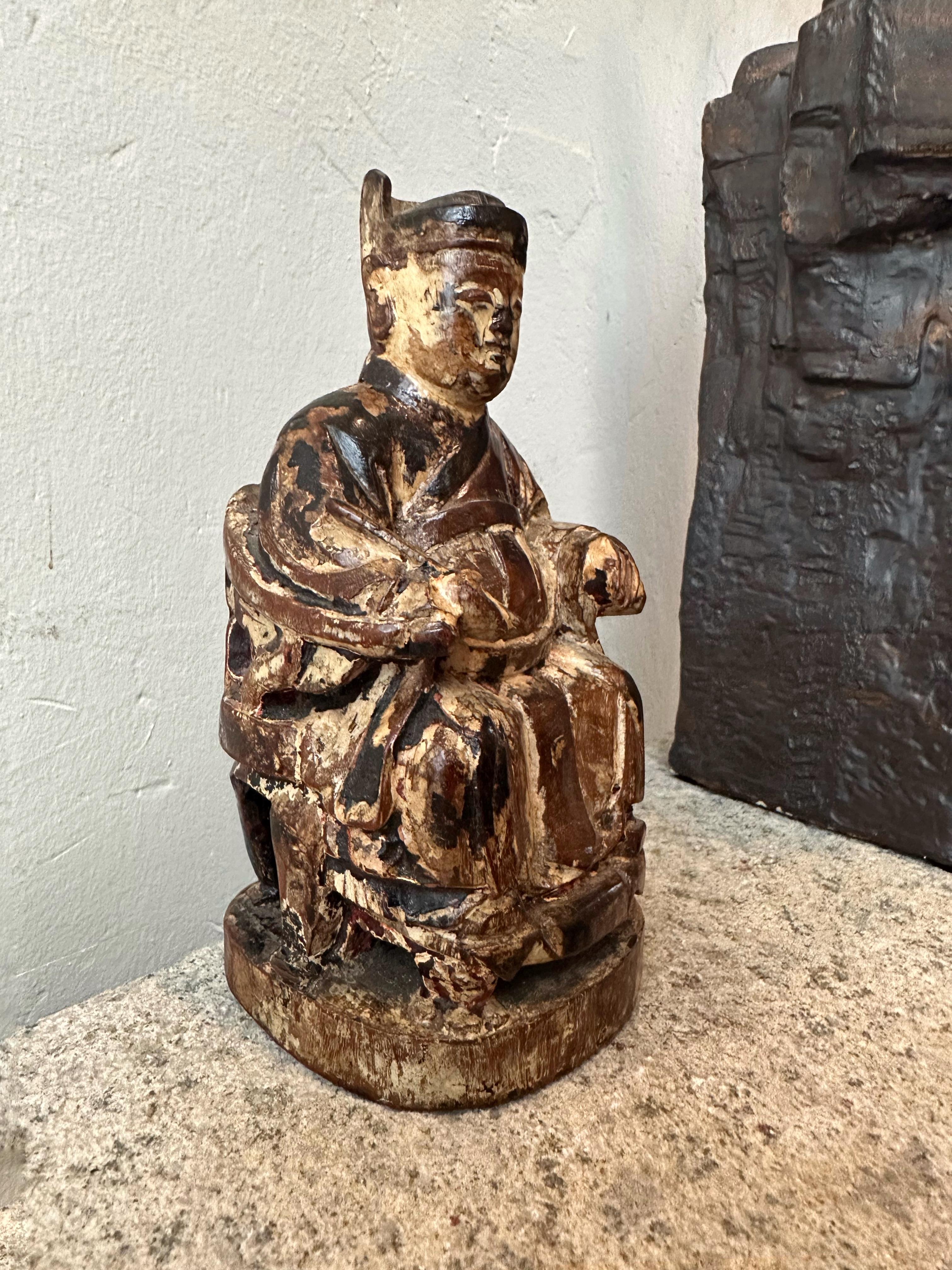 A handsome wooden figure of the Kitchen God (灶神 in Chinese, pronounced zào shén), the Chinese name can also be translated into Stove God. He is a popular ancient deity and was mentioned as early as the Jin period (265-420). The task of the Kitchen