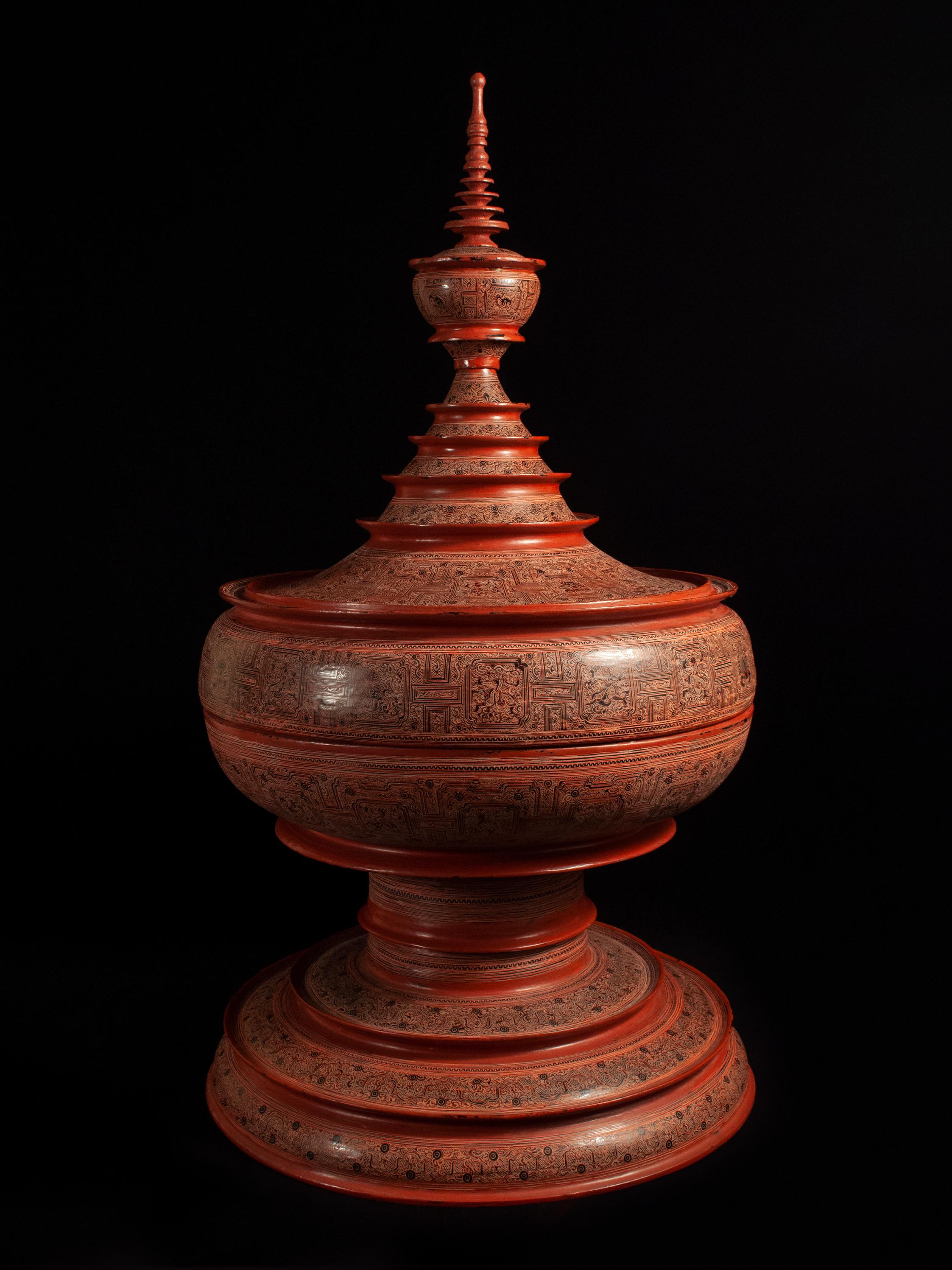 Early 20th century lacquer and bamboo offering Vessel, Hsun Ok, Pagan, Burma

An imposing offering vessel composed of six pieces, with an inner tray adorned with the image of an elephant. The stepped panels of the two center bands are known as