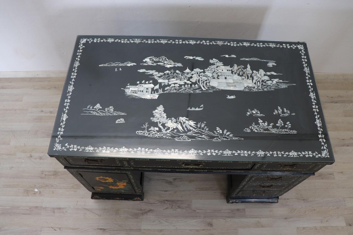 Early 20th century beautiful writing desk. This desk is unique on 1stdibs! You won't find another with such fantastic mother of pearl inlay work. I invite you to take a good look at all the images. Made of black lacquered wood with refined hand