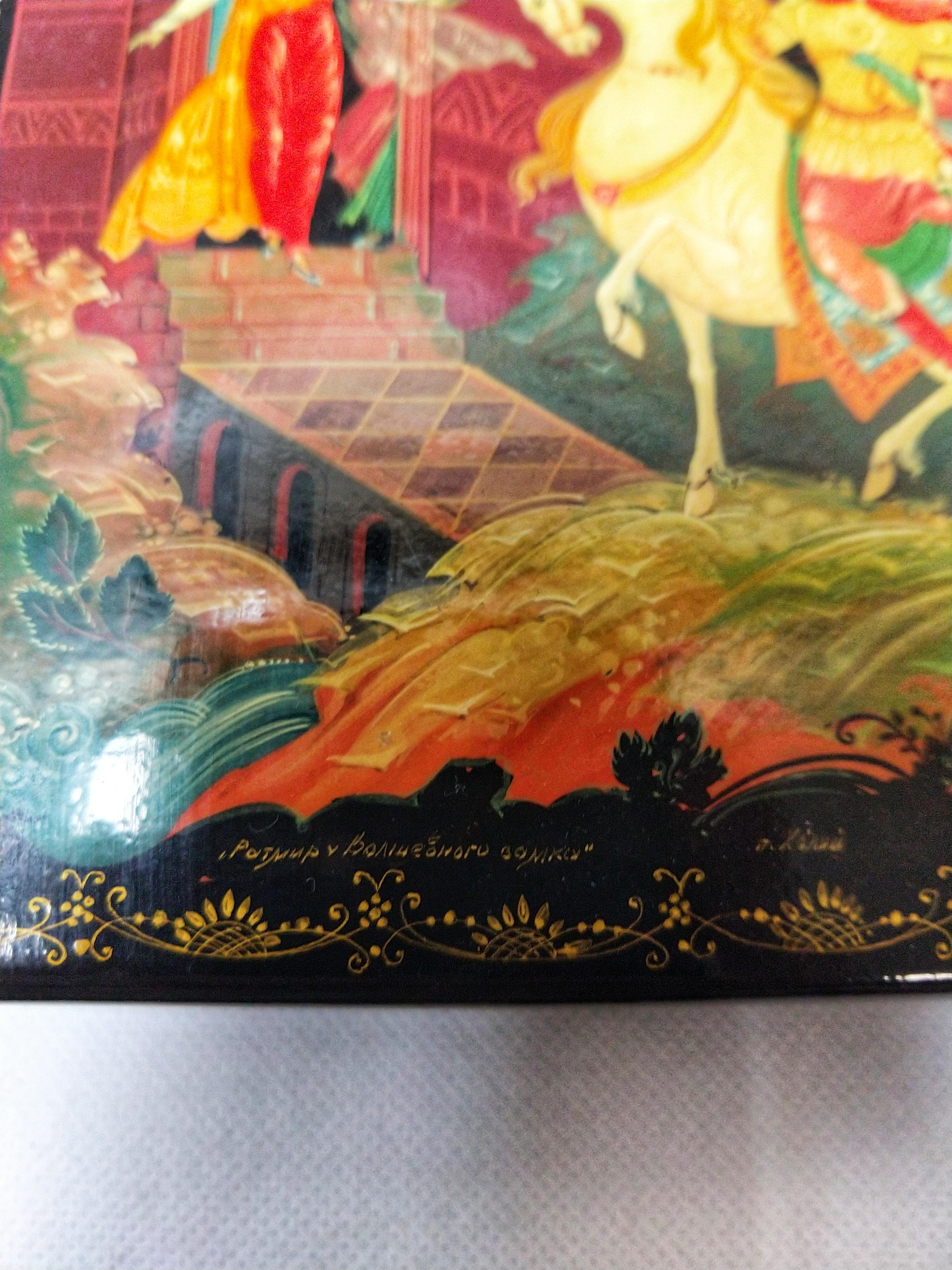 Exceptional lacquered and hand painted Russian box. The image depicts the return of the knight to his castle, with his beloved welcoming him with open arms and with festive motives for his return. Note the fabulous colors.

These hand painted