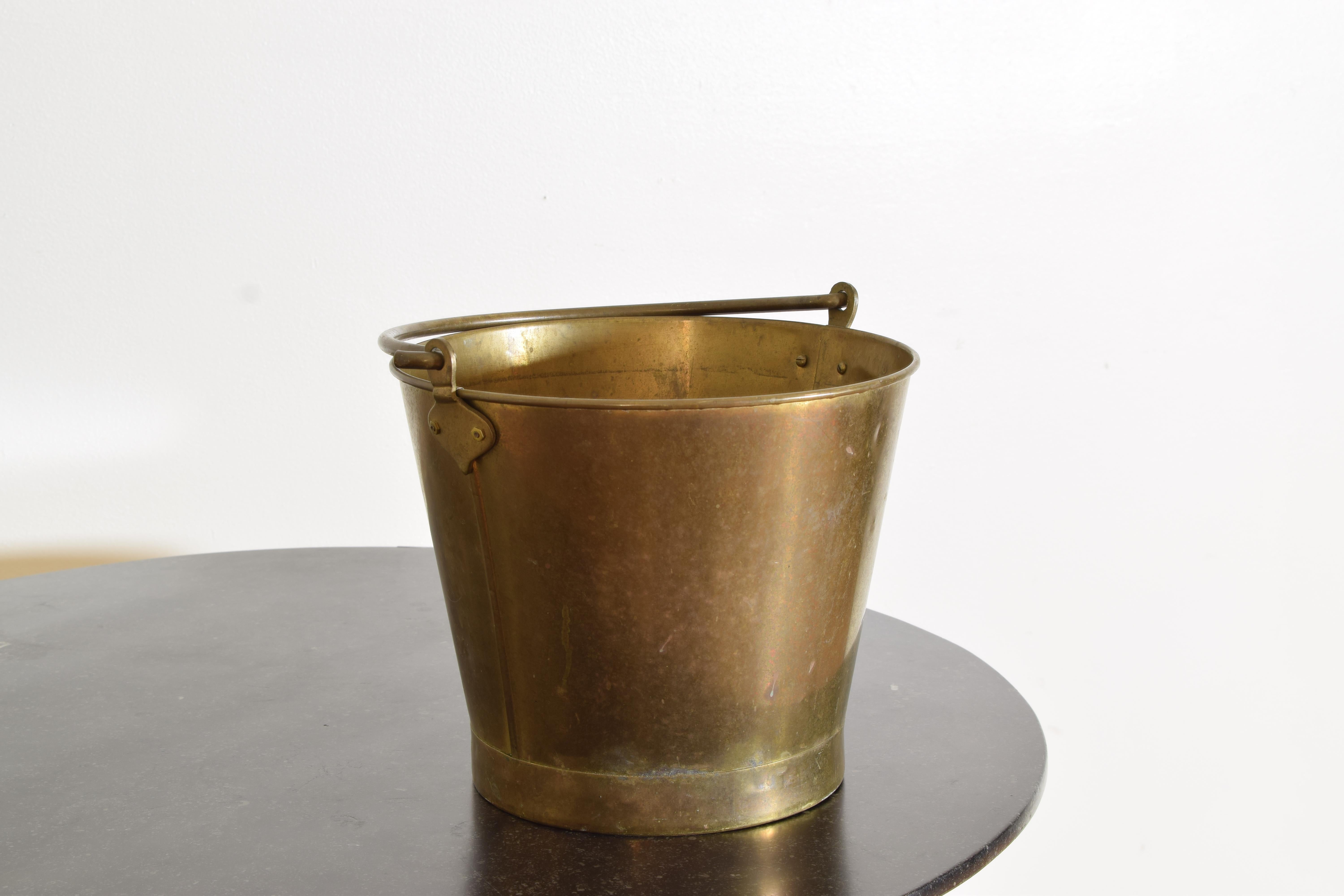 Rustic Large Hand Hammered Brass Bucket with Handle. Can Carry Water or be used as a planter. It is in good vintage condition and has a beautiful patina.

