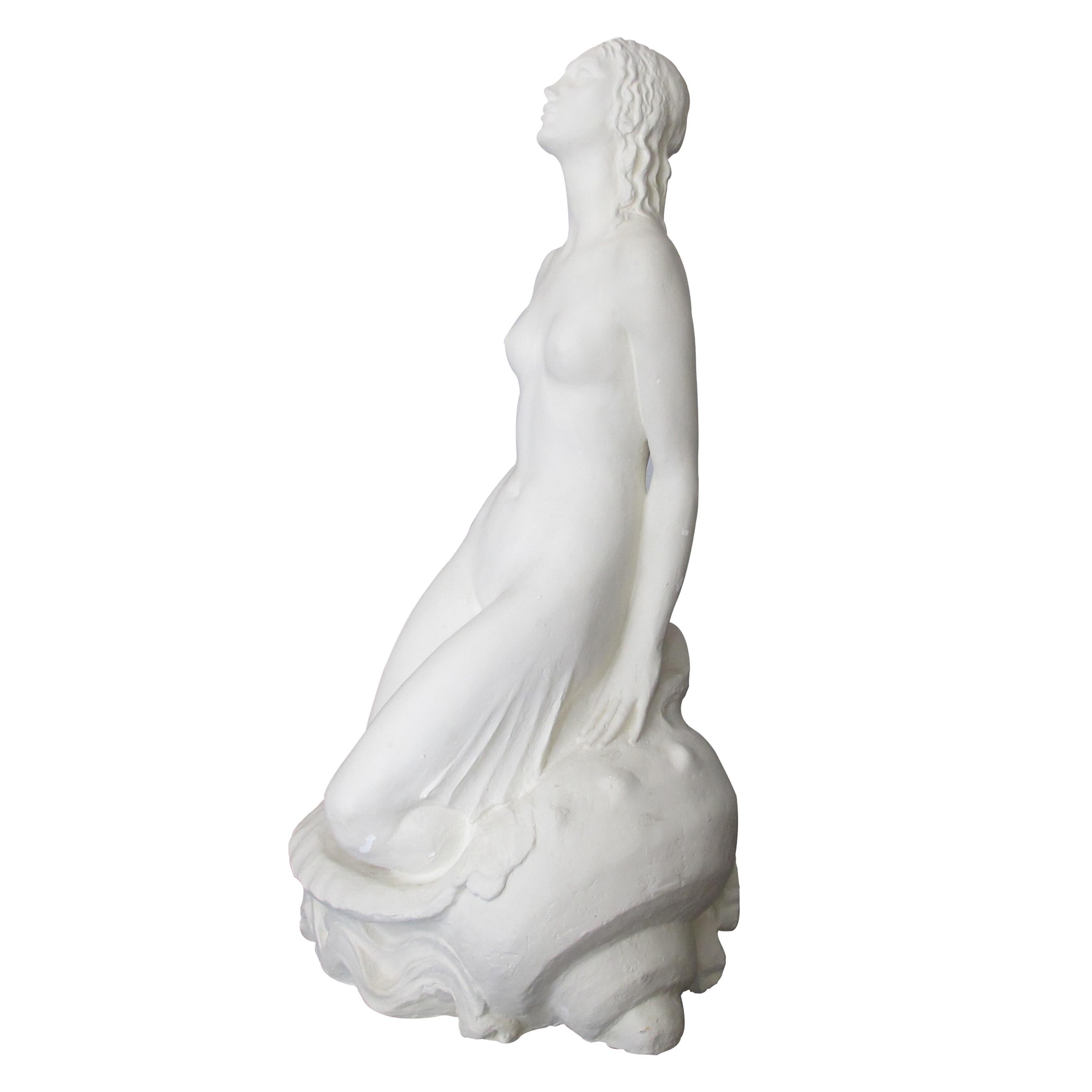 A large and elegant handcrafted plaster statue of a seated Mermaid. A wonderful statement piece with beautiful fluid lines. 

Size: H: 126 cm x W: 60 cm x D: 60 cm.
  