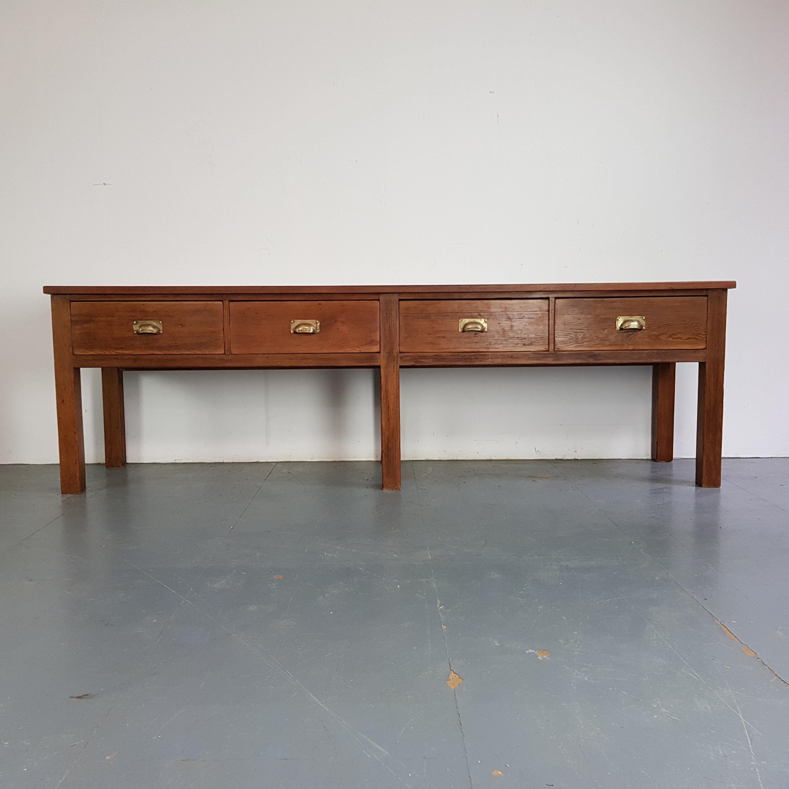 Lovely early 20th century very large pine lab bench salvaged from a boys' public school.  Great as a console table in a hallway, or in a dining room.  Would also look amazing in a kitchen. It has pigeon holes in the back so it can be completely