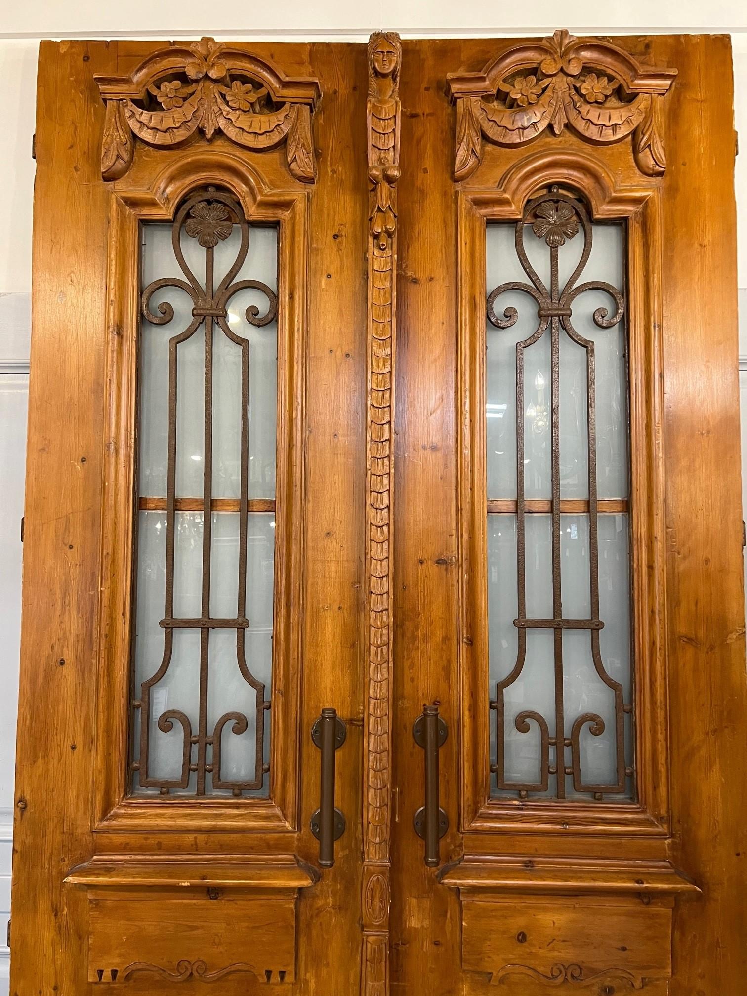 This pair of Egyptian doors were produced at a time when French architecture and style had a great influence on the Egyptian culture, especially in Cairo. They are a very impressive set of doors which would look great used both interior or exterior.