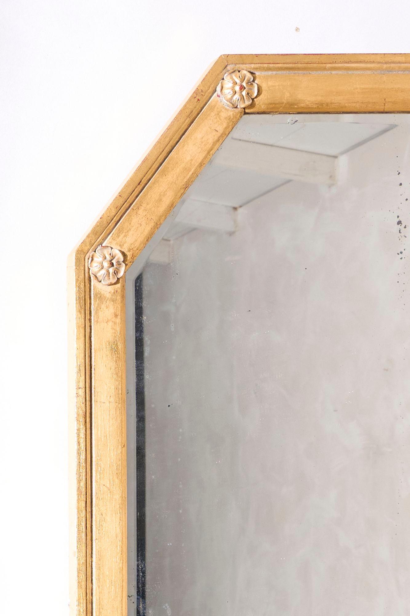This is an unusual early 20th century Gilt mirror that is in totally original condition including the mirror plate which has attractive foxing starting to appear. The size makes this hugely decorative as well. Overall condition is clean and as a