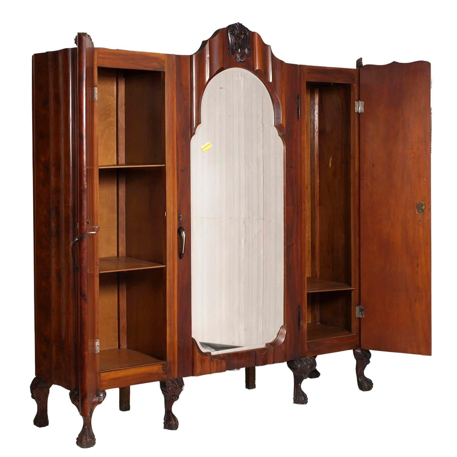 Large early 20th century Venetian Baroque wardrobe, by Testolini e Salviati, in walnut and walnut briar, with bevelled mirror. Hand carved legs and decorations in solid walnut. With three doors; two internal compartment with two shelves and central