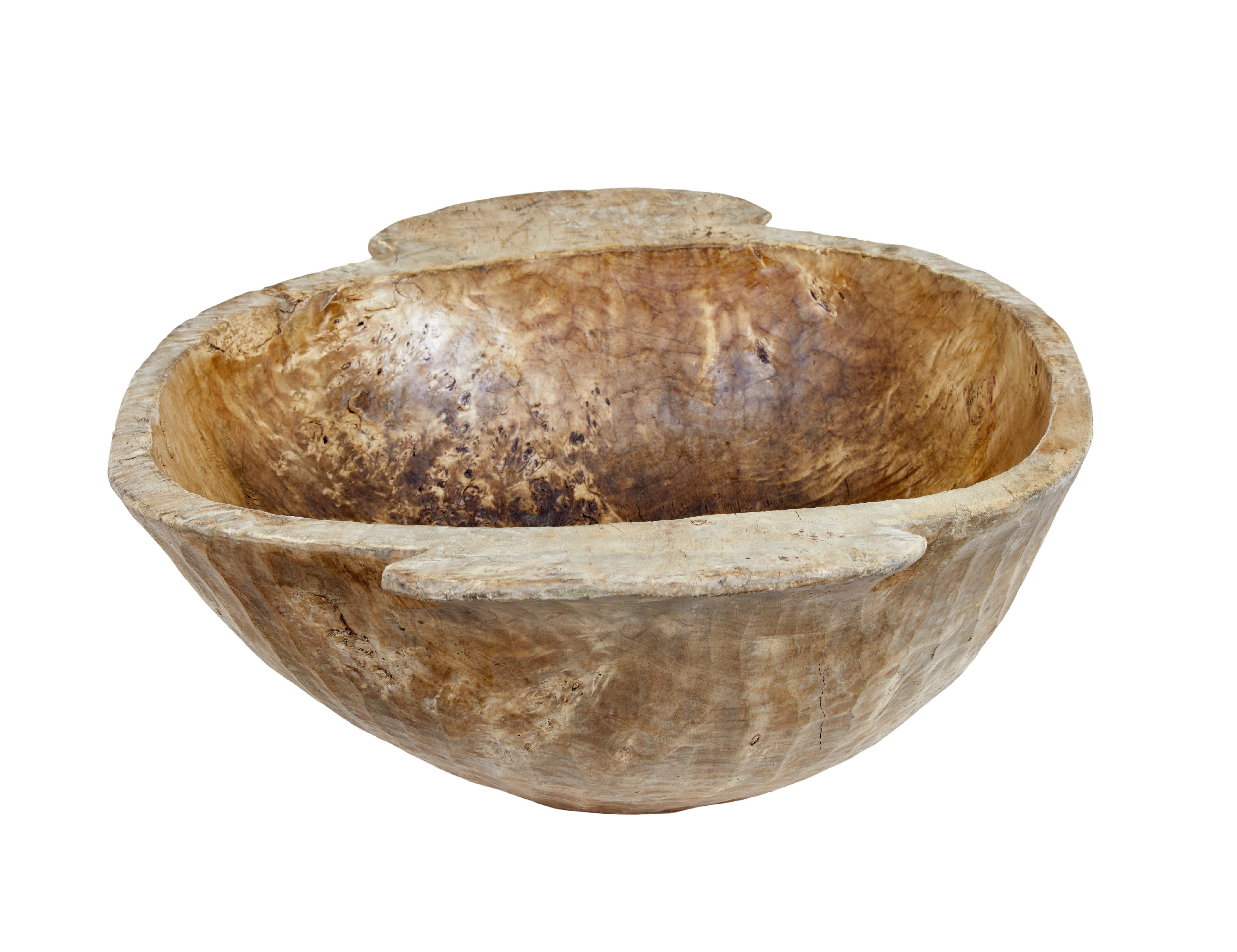 Early 20th century large wooden bowl circa 1900.

Here we offer a large wooden bowl which would have been used to feed livestock in eastern europe at the beginning of the 1900's. We have re-conditioned the bowl with a polished interior and a