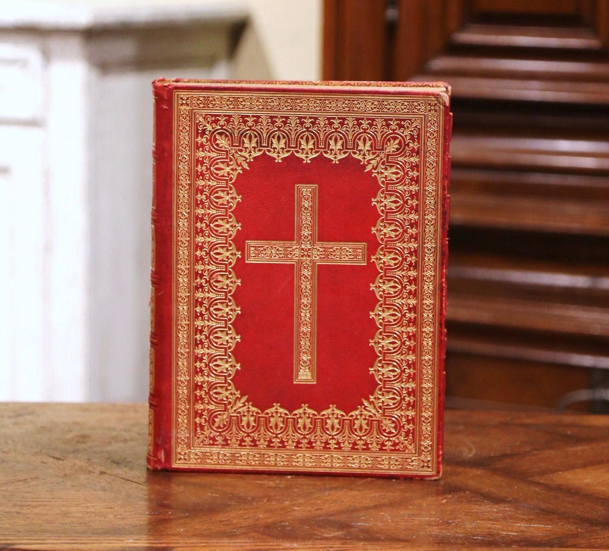 Decorate an office or study with this antique Holy book. Printed in Italy circa 1923, the Missale Romanum is written in Latin and bounded in a red leather cover with gilt tooling and gold leaf edge pages; it is illustrated with black and white plate