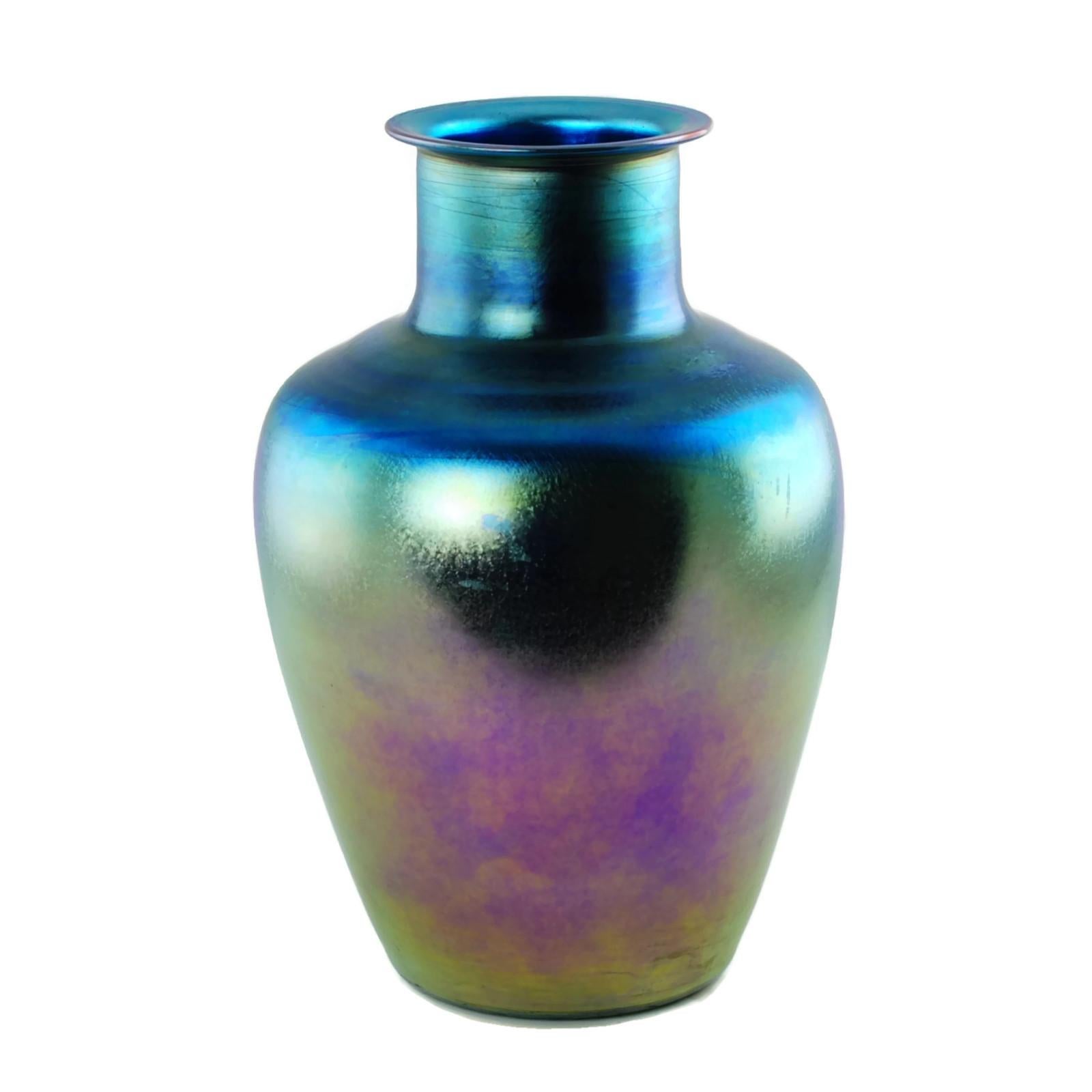 This early 20th century signed and numbered Favrile art glass vase was made by Tiffany Furnaces. The 12