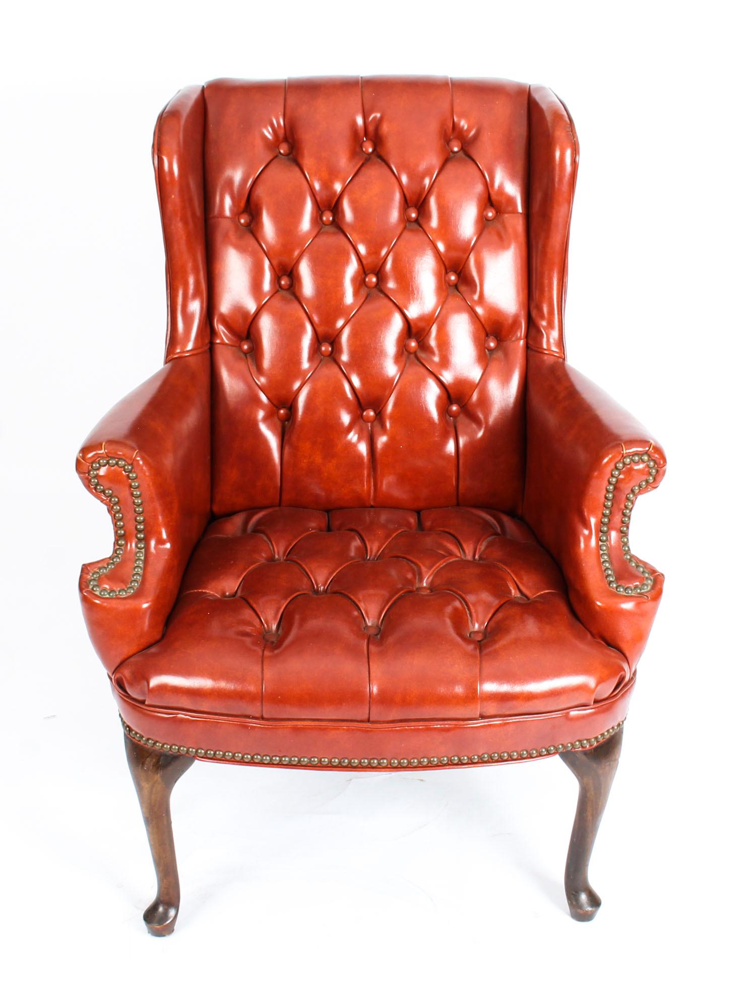 This is a very handsome antique Chippendale Revival Chesterfield wingback leather armchair, circa 1900 in date.
This beautiful armchair is upholstered in a sumptuous tan leather, features a buttoned back and seat, with scrolled arms inlaid with